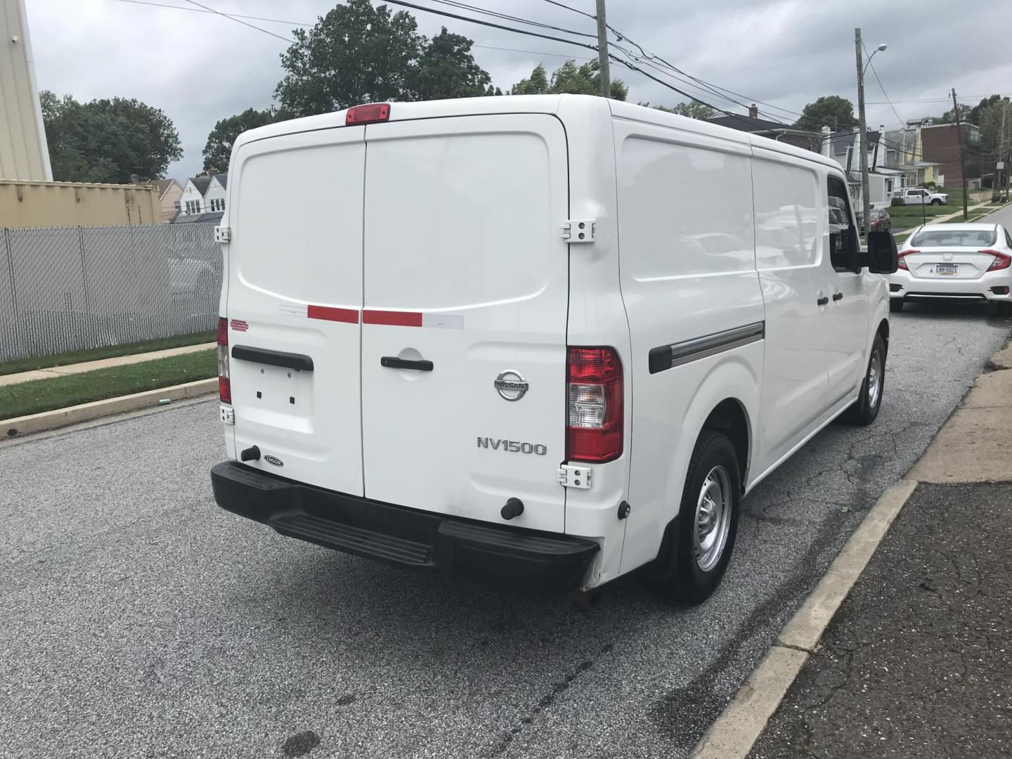 2018 White /Gray Nissan NV Cargo 1500 S (1N6BF0KM4JN) with an 4.0L V6 engine, 5A transmission, located at 577 Chester Pike, Prospect Park, PA, 19076, (610) 237-1015, 39.886154, -75.302338 - 2018 Nissan NV 1500 S: Shelving, backup camera, new PA inspection, heavy duty partition, FLEET MAINTAINED, runs LIKE NEW! This vehicle comes inspected and has been given a bumper to bumper safety check. It is very clean, reliable, and well maintained. We offer a unique pay plan that is known for - Photo#4