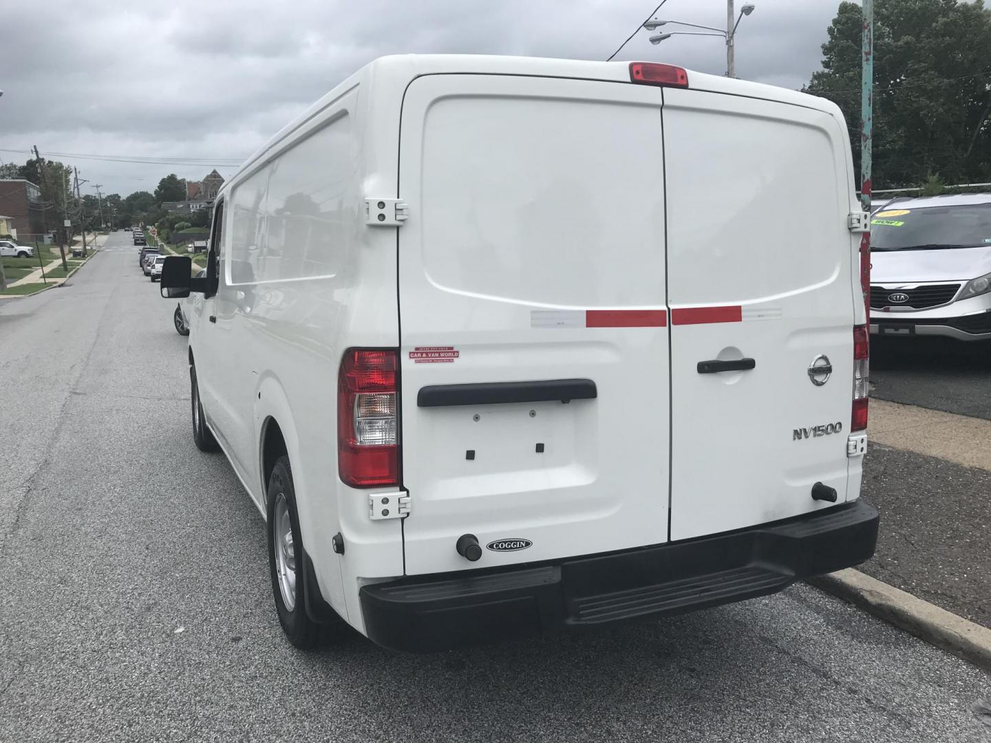 2018 White /Gray Nissan NV Cargo 1500 S (1N6BF0KM4JN) with an 4.0L V6 engine, 5A transmission, located at 577 Chester Pike, Prospect Park, PA, 19076, (610) 237-1015, 39.886154, -75.302338 - 2018 Nissan NV 1500 S: Shelving, backup camera, new PA inspection, heavy duty partition, FLEET MAINTAINED, runs LIKE NEW! This vehicle comes inspected and has been given a bumper to bumper safety check. It is very clean, reliable, and well maintained. We offer a unique pay plan that is known for - Photo#5