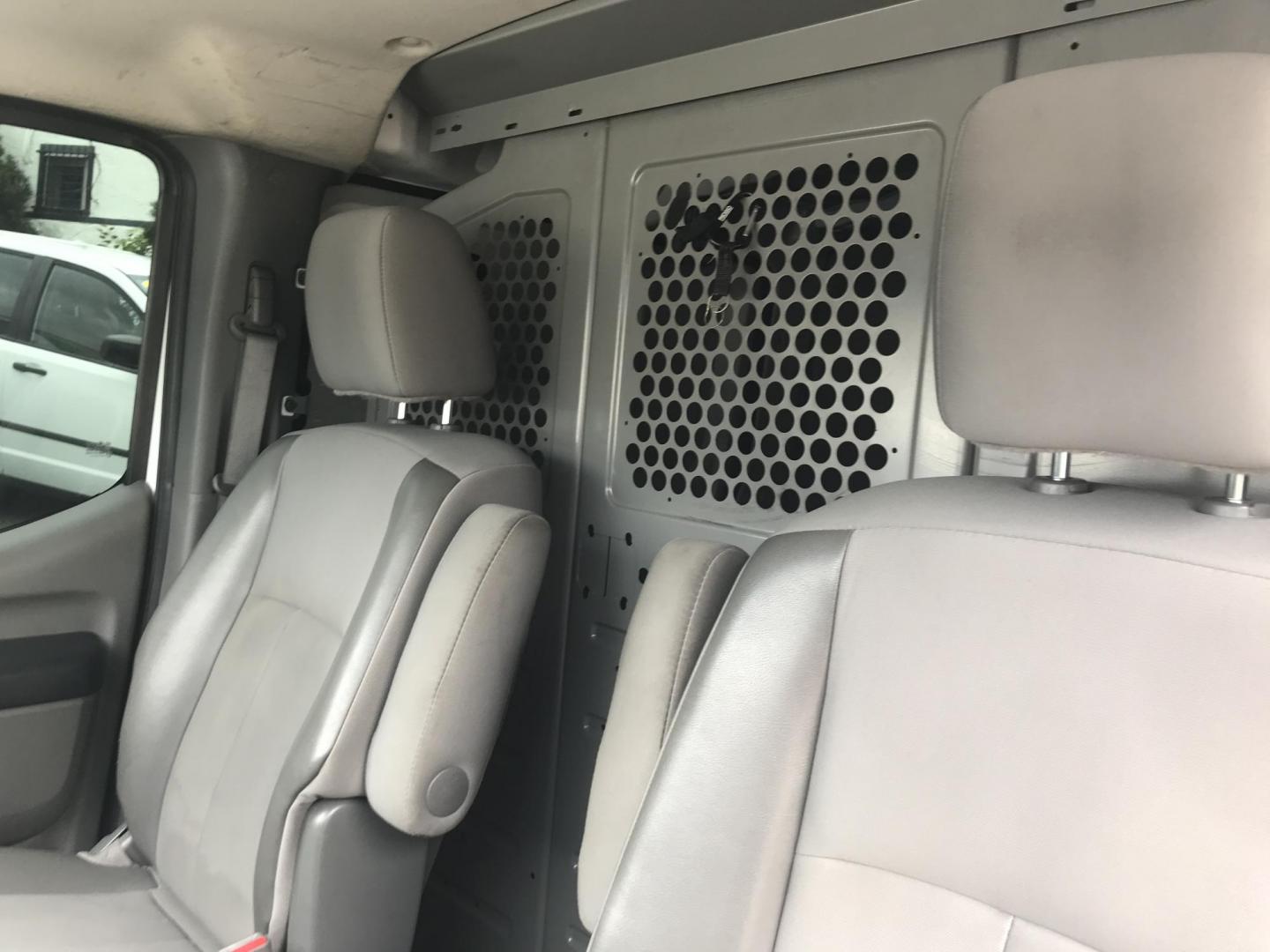 2018 White /Gray Nissan NV Cargo 1500 S (1N6BF0KM4JN) with an 4.0L V6 engine, 5A transmission, located at 577 Chester Pike, Prospect Park, PA, 19076, (610) 237-1015, 39.886154, -75.302338 - 2018 Nissan NV 1500 S: Shelving, backup camera, new PA inspection, heavy duty partition, FLEET MAINTAINED, runs LIKE NEW! This vehicle comes inspected and has been given a bumper to bumper safety check. It is very clean, reliable, and well maintained. We offer a unique pay plan that is known for - Photo#9