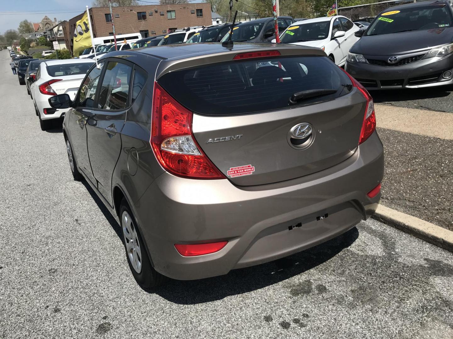 2014 Gold /Tan Hyundai Accent GS 5-Door (KMHCT5AE9EU) with an 1.6L L4 DOHC 16V engine, Automatic transmission, located at 577 Chester Pike, Prospect Park, PA, 19076, (610) 237-1015, 39.886154, -75.302338 - 2014 Hyundai Accent GS: Only 95k miles, new PA inspection, great on gas, runs EXCELLENT! This vehicle comes inspected and has been given a bumper to bumper safety check. It is very clean, reliable, and well maintained. We offer a unique pay plan that is known for being the easiest and fastest fin - Photo#5