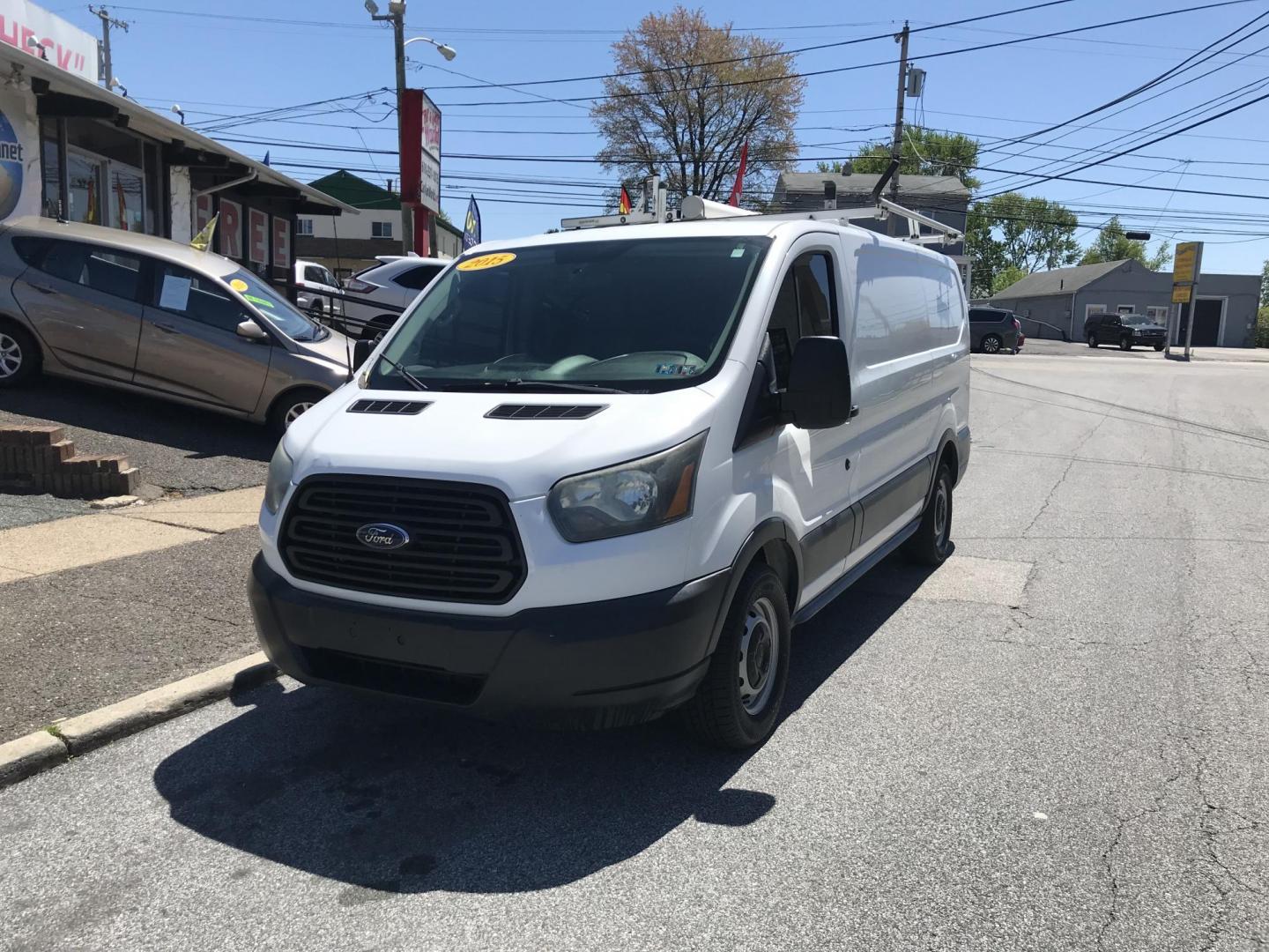 2015 White /Gray Ford Transit 150 Van Low Roof w/Sliding Pass. 130-in. WB (1FTNE1YM7FK) with an 3.7L V6 DOHC 24V engine, 6-Speed Automatic transmission, located at 577 Chester Pike, Prospect Park, PA, 19076, (610) 237-1015, 39.886154, -75.302338 - 2015 Ford Transit 150 Low Roof: Only 139k miles, ladder racks, multiple pieces of shelving, partition, FLEET MAINTAINED, runs LIKE NEW! This vehicle comes inspected and has been given a bumper to bumper safety check. It is very clean, reliable, and well maintained. We offer a unique pay plan that - Photo#1