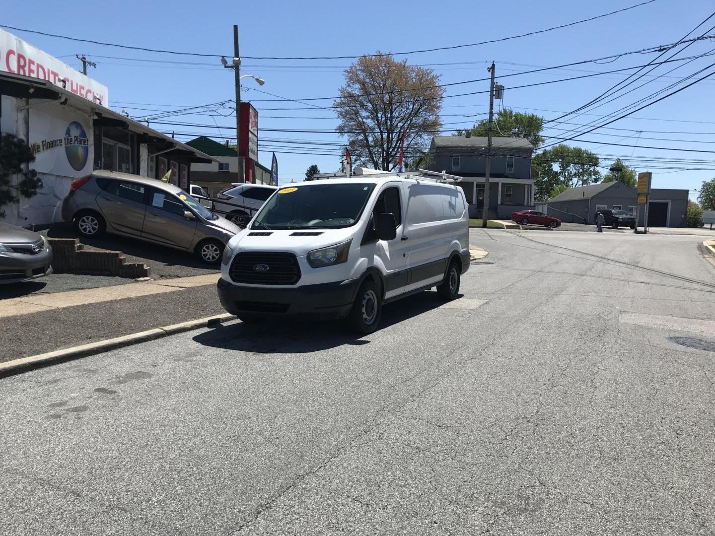 2015 White /Gray Ford Transit 150 Van Low Roof w/Sliding Pass. 130-in. WB (1FTNE1YM7FK) with an 3.7L V6 DOHC 24V engine, 6-Speed Automatic transmission, located at 577 Chester Pike, Prospect Park, PA, 19076, (610) 237-1015, 39.886154, -75.302338 - 2015 Ford Transit 150 Low Roof: Only 139k miles, ladder racks, multiple pieces of shelving, partition, FLEET MAINTAINED, runs LIKE NEW! This vehicle comes inspected and has been given a bumper to bumper safety check. It is very clean, reliable, and well maintained. We offer a unique pay plan that - Photo#3