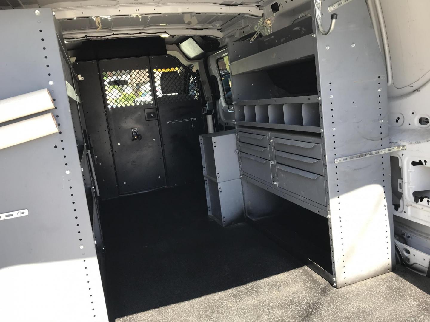 2015 White /Gray Ford Transit 150 Van Low Roof w/Sliding Pass. 130-in. WB (1FTNE1YM7FK) with an 3.7L V6 DOHC 24V engine, 6-Speed Automatic transmission, located at 577 Chester Pike, Prospect Park, PA, 19076, (610) 237-1015, 39.886154, -75.302338 - 2015 Ford Transit 150 Low Roof: Only 139k miles, ladder racks, multiple pieces of shelving, partition, FLEET MAINTAINED, runs LIKE NEW! This vehicle comes inspected and has been given a bumper to bumper safety check. It is very clean, reliable, and well maintained. We offer a unique pay plan that - Photo#15