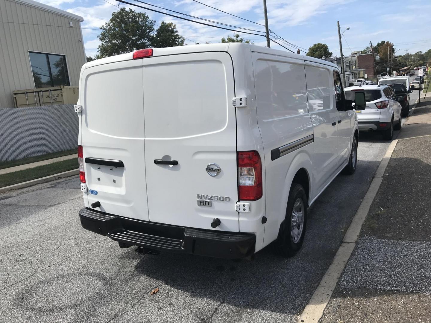 2015 White /Gray Nissan NV Cargo 3500 HD S High Roof (1N6AF0KY9FN) with an 5.6L V8 DOHC 32V engine, 5-Speed Automatic transmission, located at 577 Chester Pike, Prospect Park, PA, 19076, (610) 237-1015, 39.886154, -75.302338 - 2015 Nissan 2500 Cargo Van: Has multiple pieces of shelving, new PA inspection, heavy duty partition, FLEET MAINTAINED! This vehicle comes inspected and has been given a bumper to bumper safety check. It is very clean, reliable, and well maintained. We offer a unique pay plan that is known for be - Photo#5