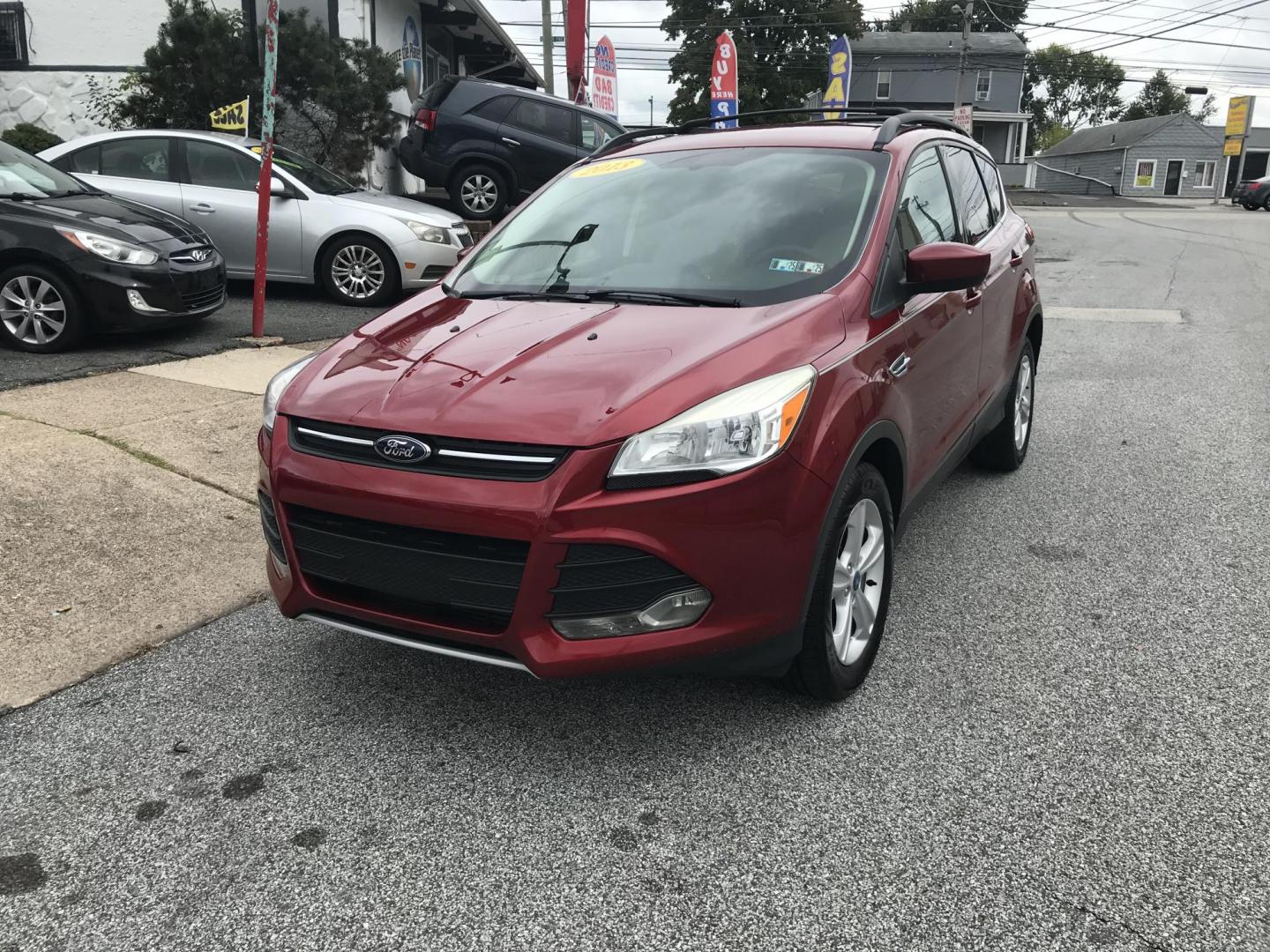 2013 Red /Tan Ford Escape SE AWD (1FMCU9GXXDU) with an 1.6L L4 DOHC 16V engine, 6-Speed Automatic transmission, located at 577 Chester Pike, Prospect Park, PA, 19076, (610) 237-1015, 39.886154, -75.302338 - Photo#1