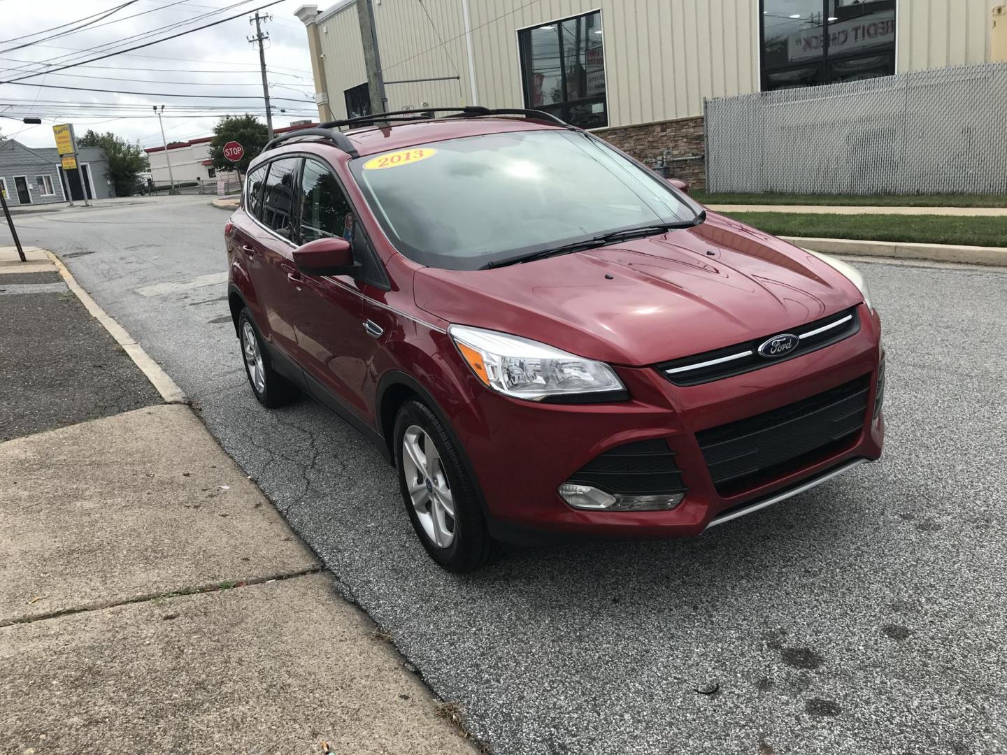 2013 Red /Tan Ford Escape SE AWD (1FMCU9GXXDU) with an 1.6L L4 DOHC 16V engine, 6-Speed Automatic transmission, located at 577 Chester Pike, Prospect Park, PA, 19076, (610) 237-1015, 39.886154, -75.302338 - Photo#3