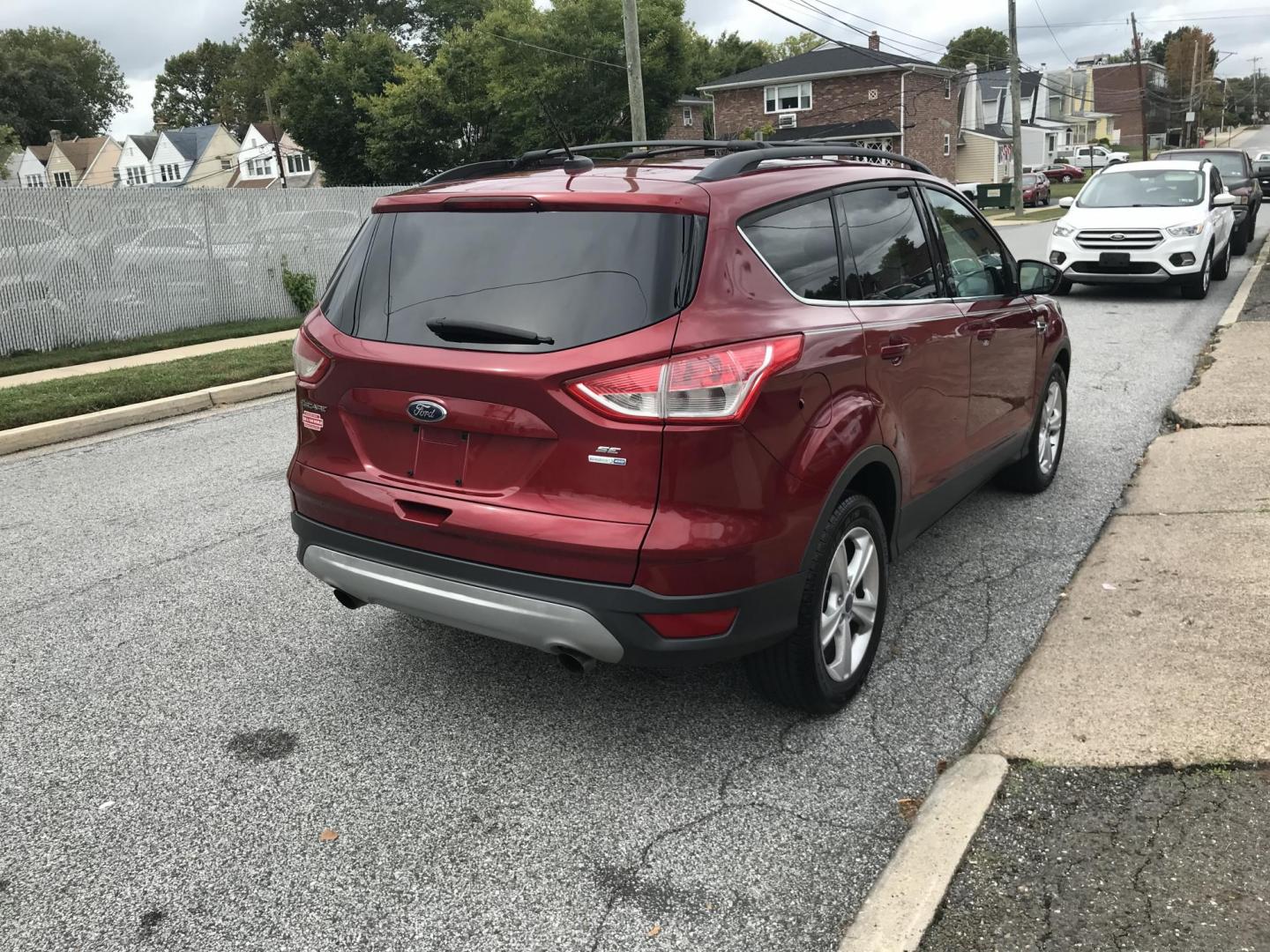 2013 Red /Tan Ford Escape SE AWD (1FMCU9GXXDU) with an 1.6L L4 DOHC 16V engine, 6-Speed Automatic transmission, located at 577 Chester Pike, Prospect Park, PA, 19076, (610) 237-1015, 39.886154, -75.302338 - Photo#5
