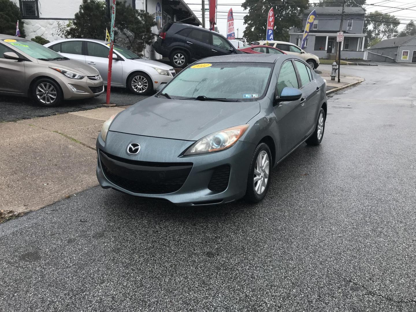 2012 Green /Gray Mazda MAZDA3 i Touring 4-Door (JM1BL1V87C1) with an 2.0L L4 DOHC 16V engine, Automatic transmission, located at 577 Chester Pike, Prospect Park, PA, 19076, (610) 237-1015, 39.886154, -75.302338 - 2012 Mazda 3 i Touring: Only 123k miles, great on gas, sunroof, new PA inspection, runs LIKE NEW! This vehicle comes inspected and has been given a bumper to bumper safety check. It is very clean, reliable, and well maintained. We offer a unique pay plan that is known for being the easiest and fa - Photo#3