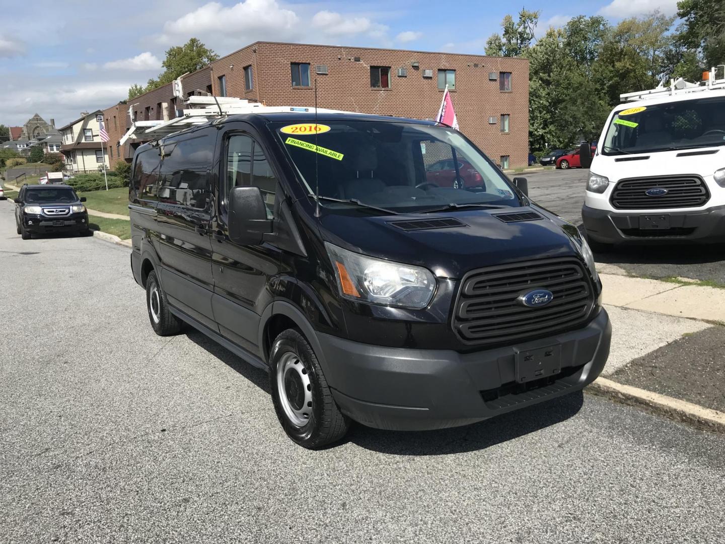 2016 Black /Gray Ford Transit 150 Van Low Roof w/Sliding Pass. 130-in. WB (1FTYE1YM4GK) with an 3.7L V6 DOHC 24V engine, 6A transmission, located at 577 Chester Pike, Prospect Park, PA, 19076, (610) 237-1015, 39.886154, -75.302338 - Photo#1