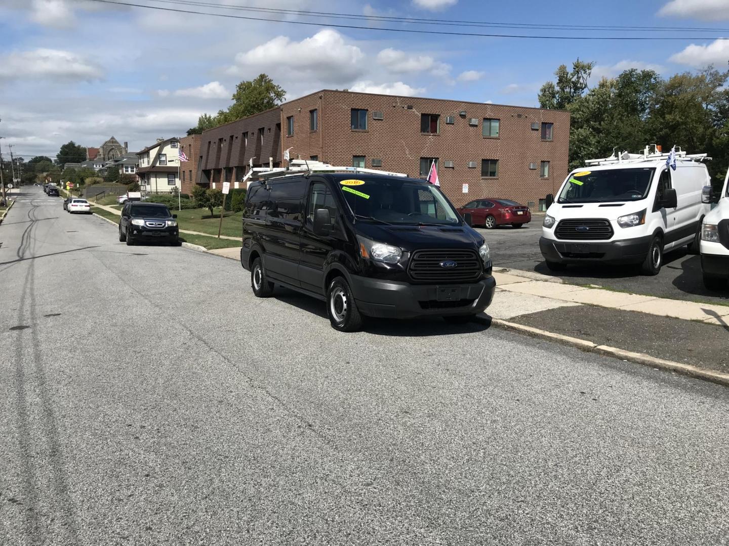 2016 Black /Gray Ford Transit 150 Van Low Roof w/Sliding Pass. 130-in. WB (1FTYE1YM4GK) with an 3.7L V6 DOHC 24V engine, 6A transmission, located at 577 Chester Pike, Prospect Park, PA, 19076, (610) 237-1015, 39.886154, -75.302338 - Photo#2