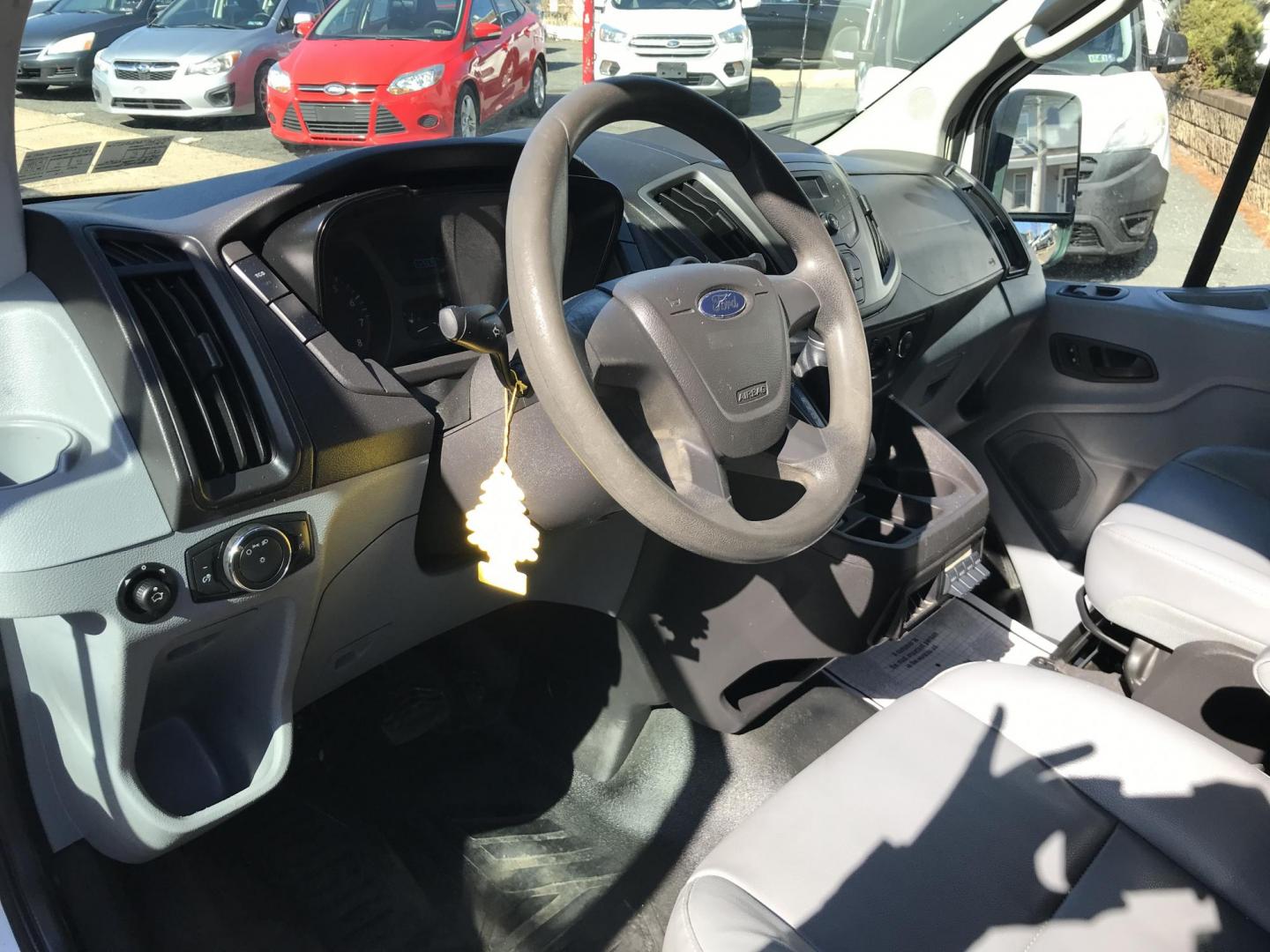 2015 White /Gray Ford Transit 150 Van Med. Roof w/Sliding Pass. 130-in. WB (1FTNE1YMXFK) with an 3.7L V6 DOHC 24V engine, 6-Speed Automatic transmission, located at 577 Chester Pike, Prospect Park, PA, 19076, (610) 237-1015, 39.886154, -75.302338 - 2015 Ford Transit 150 Low Roof: Only 102k miles, drop down ladder racks, shelving, power inverter, partition, new PA inspection, FLEET MAINTAINED! This vehicle comes inspected and has been given a bumper to bumper safety check. It is very clean, reliable, and well maintained. We offer a unique pa - Photo#12