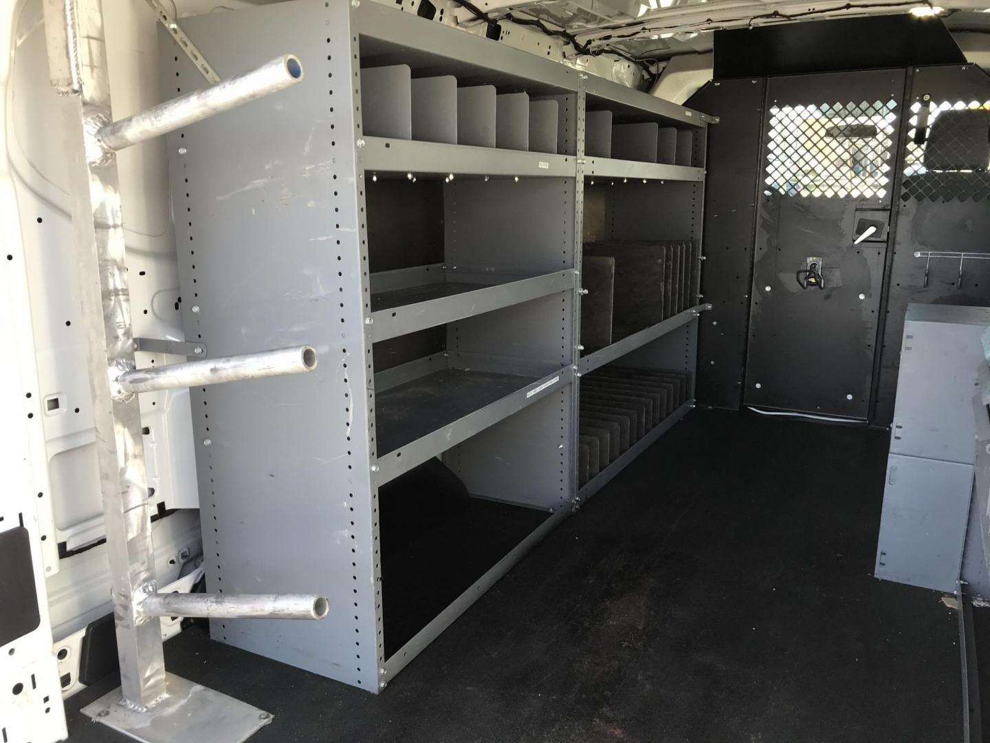 2015 White /Gray Ford Transit 150 Van Med. Roof w/Sliding Pass. 130-in. WB (1FTNE1YMXFK) with an 3.7L V6 DOHC 24V engine, 6-Speed Automatic transmission, located at 577 Chester Pike, Prospect Park, PA, 19076, (610) 237-1015, 39.886154, -75.302338 - 2015 Ford Transit 150 Low Roof: Only 102k miles, drop down ladder racks, shelving, power inverter, partition, new PA inspection, FLEET MAINTAINED! This vehicle comes inspected and has been given a bumper to bumper safety check. It is very clean, reliable, and well maintained. We offer a unique pa - Photo#18