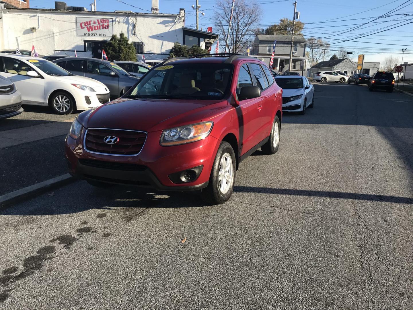 2011 Red /Tan Hyundai Santa Fe GLS 2.4 (5XYZG3AB8BG) with an 2.4L L4 DOHC 16V engine, 6-Speed Automatic transmission, located at 577 Chester Pike, Prospect Park, PA, 19076, (610) 237-1015, 39.886154, -75.302338 - Photo#1