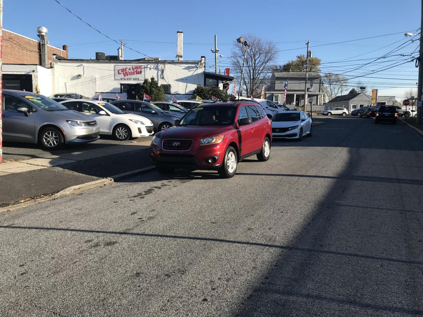 2011 Red /Tan Hyundai Santa Fe GLS 2.4 (5XYZG3AB8BG) with an 2.4L L4 DOHC 16V engine, 6-Speed Automatic transmission, located at 577 Chester Pike, Prospect Park, PA, 19076, (610) 237-1015, 39.886154, -75.302338 - Photo#2
