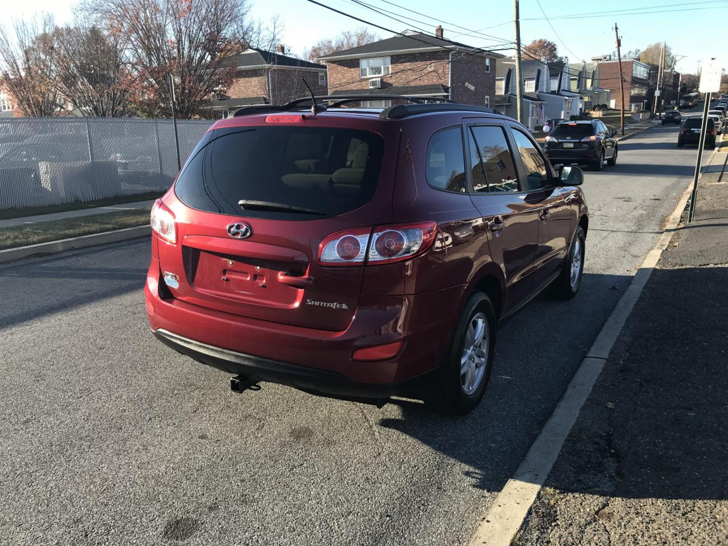 2011 Red /Tan Hyundai Santa Fe GLS 2.4 (5XYZG3AB8BG) with an 2.4L L4 DOHC 16V engine, 6-Speed Automatic transmission, located at 577 Chester Pike, Prospect Park, PA, 19076, (610) 237-1015, 39.886154, -75.302338 - Photo#5