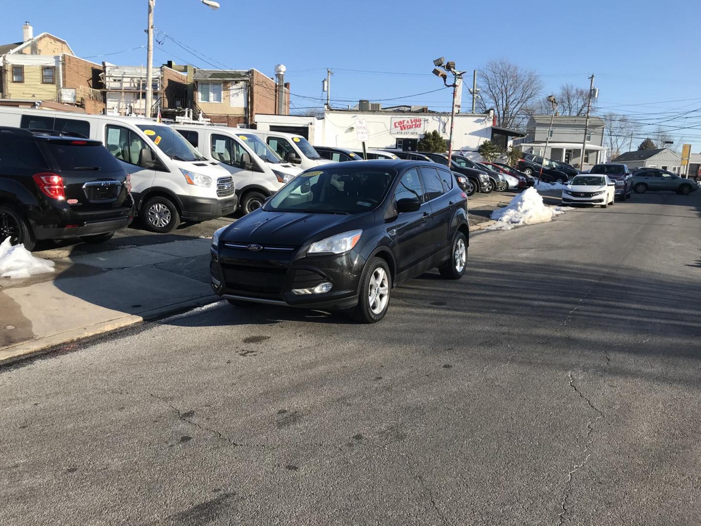 2013 Black /Gray Ford Escape SE (1FMCU0G99DU) with an 2.0L L4 DOHC 16V engine, 6-Speed Automatic transmission, located at 577 Chester Pike, Prospect Park, PA, 19076, (610) 237-1015, 39.886154, -75.302338 - 2013 Ford Escape SE: Only 98k miles, sunroof, great on gas, new PA inspection, runs excellent, SUPER CLEAN! This vehicle comes inspected and has been given a bumper to bumper safety check. It is very clean, reliable, and well maintained. We offer a unique pay plan that is known for being the easi - Photo#1