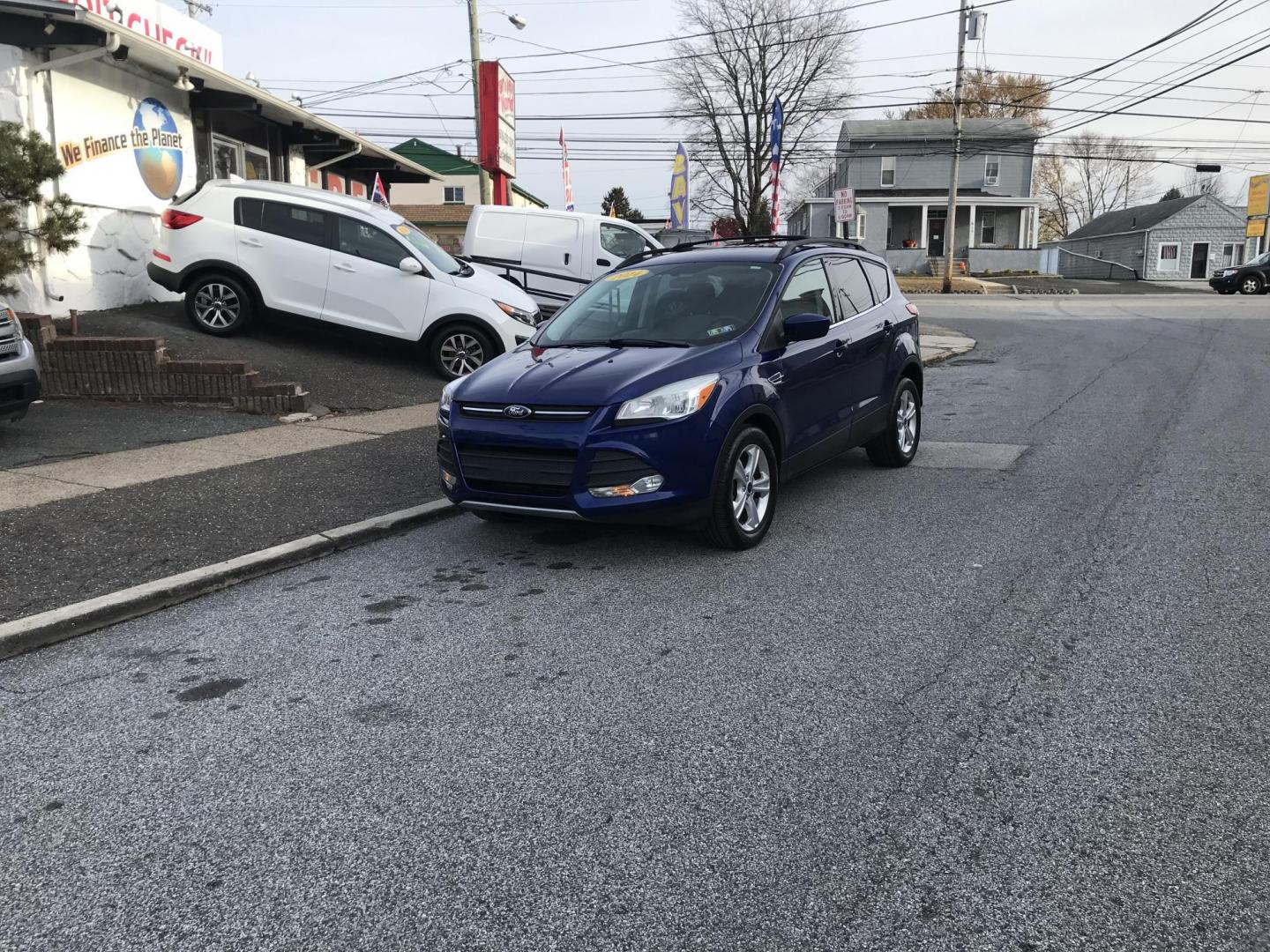 2014 Blue /Gray Ford Escape SE (1FMCU0GX7EU) with an 1.6L L4 DOHC 16V engine, 6-Speed Automatic transmission, located at 577 Chester Pike, Prospect Park, PA, 19076, (610) 237-1015, 39.886154, -75.302338 - Photo#1