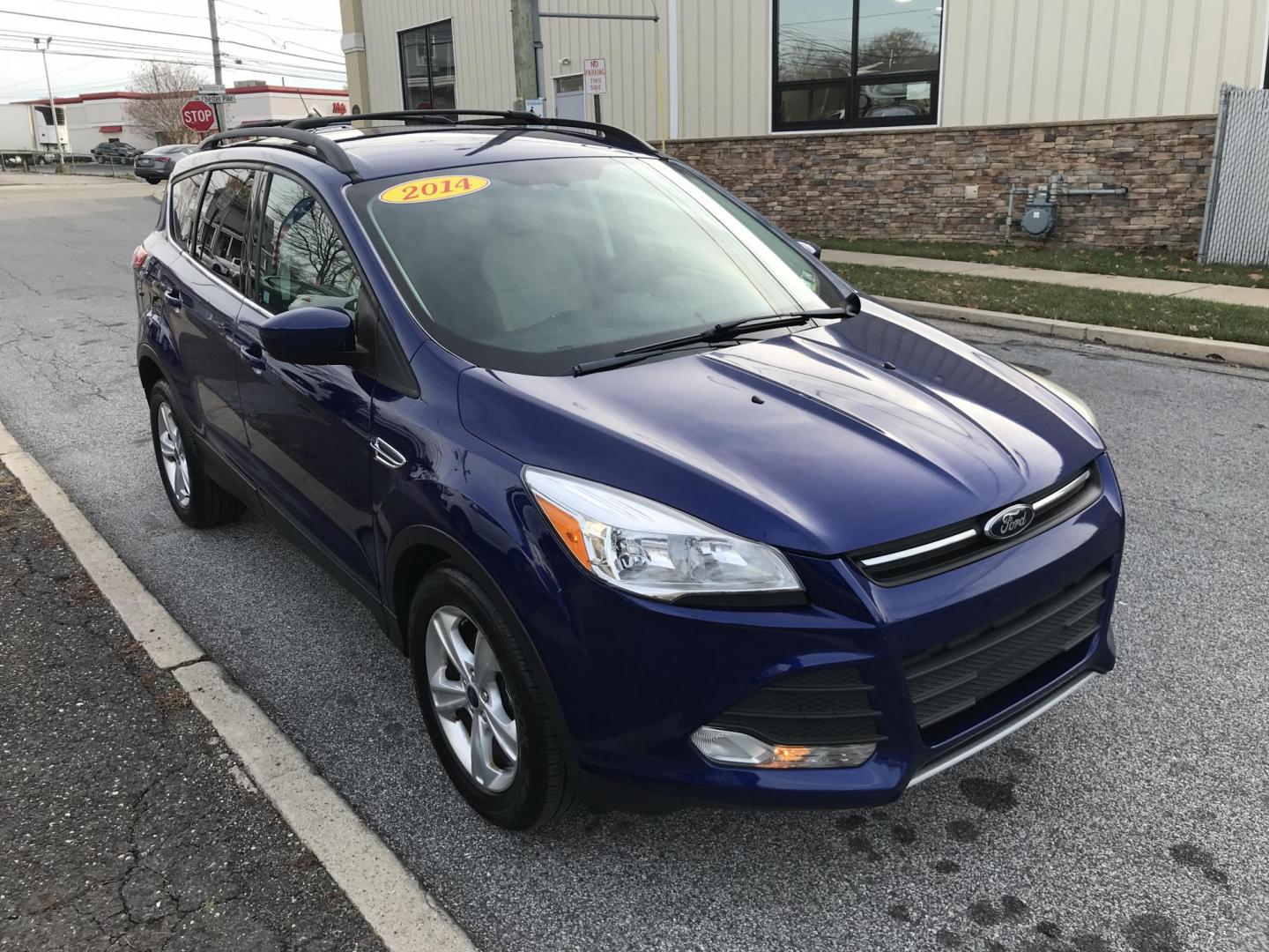 2014 Blue /Gray Ford Escape SE (1FMCU0GX7EU) with an 1.6L L4 DOHC 16V engine, 6-Speed Automatic transmission, located at 577 Chester Pike, Prospect Park, PA, 19076, (610) 237-1015, 39.886154, -75.302338 - Photo#3