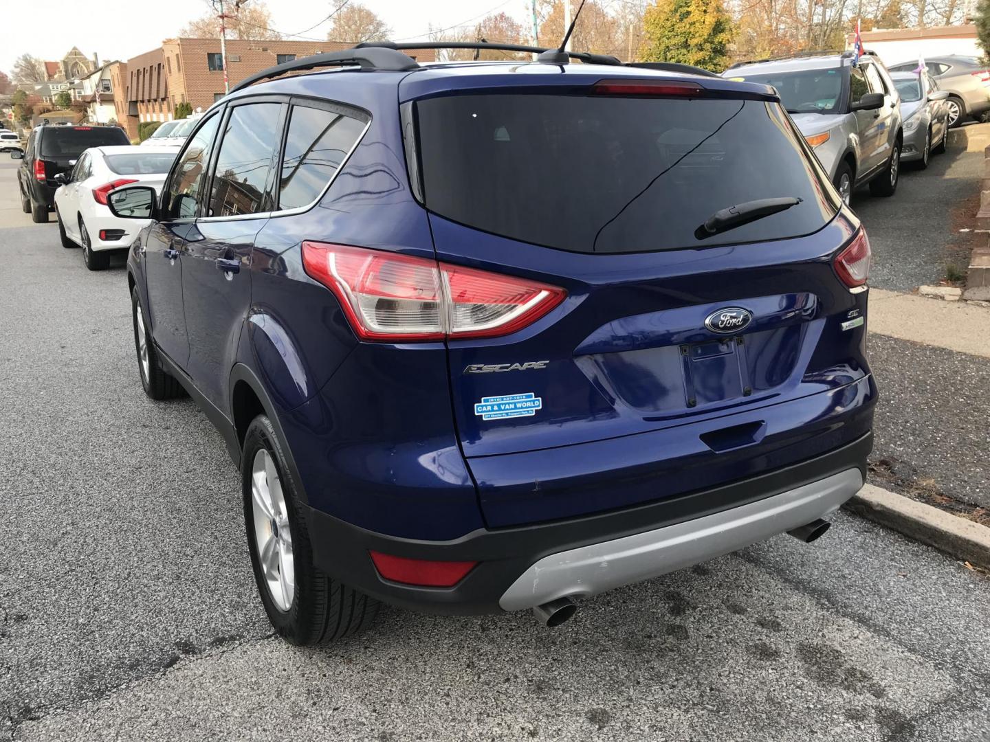 2014 Blue /Gray Ford Escape SE (1FMCU0GX7EU) with an 1.6L L4 DOHC 16V engine, 6-Speed Automatic transmission, located at 577 Chester Pike, Prospect Park, PA, 19076, (610) 237-1015, 39.886154, -75.302338 - Photo#5