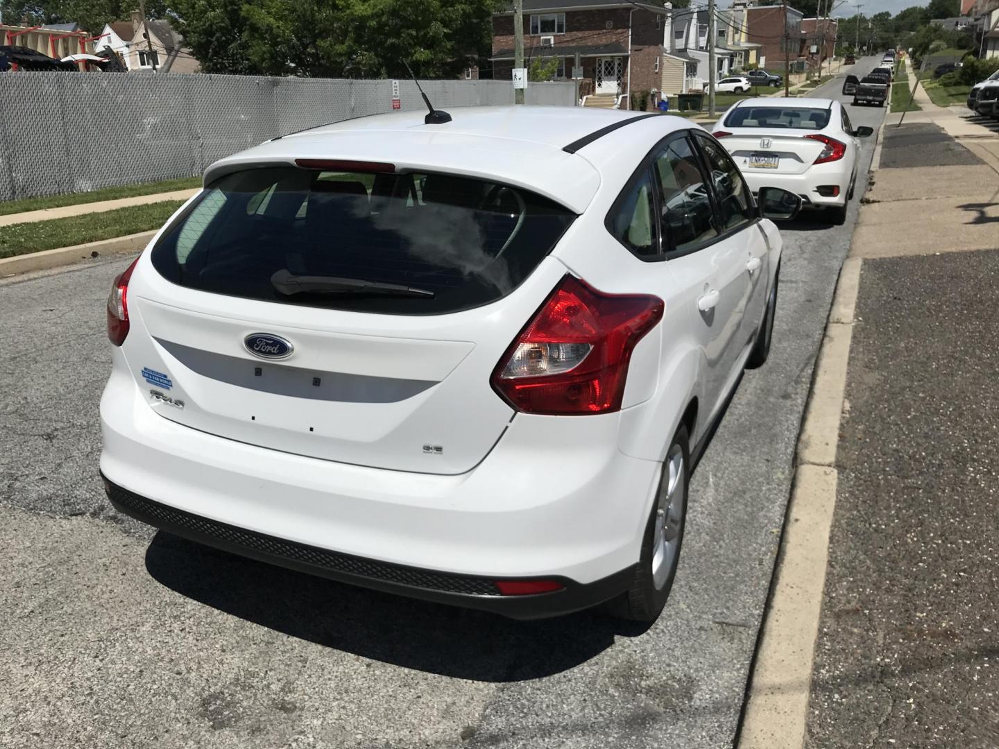 2013 White /Tan Ford Focus SE Hatch (1FADP3K25DL) with an 2.0L L4 DOHC 16V engine, Automatic transmission, located at 577 Chester Pike, Prospect Park, PA, 19076, (610) 237-1015, 39.886154, -75.302338- Photo#2