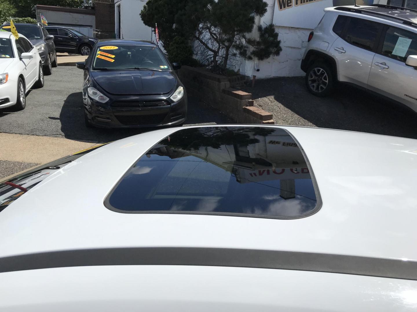2013 White /Tan Ford Focus SE Hatch (1FADP3K25DL) with an 2.0L L4 DOHC 16V engine, Automatic transmission, located at 577 Chester Pike, Prospect Park, PA, 19076, (610) 237-1015, 39.886154, -75.302338- Photo#5