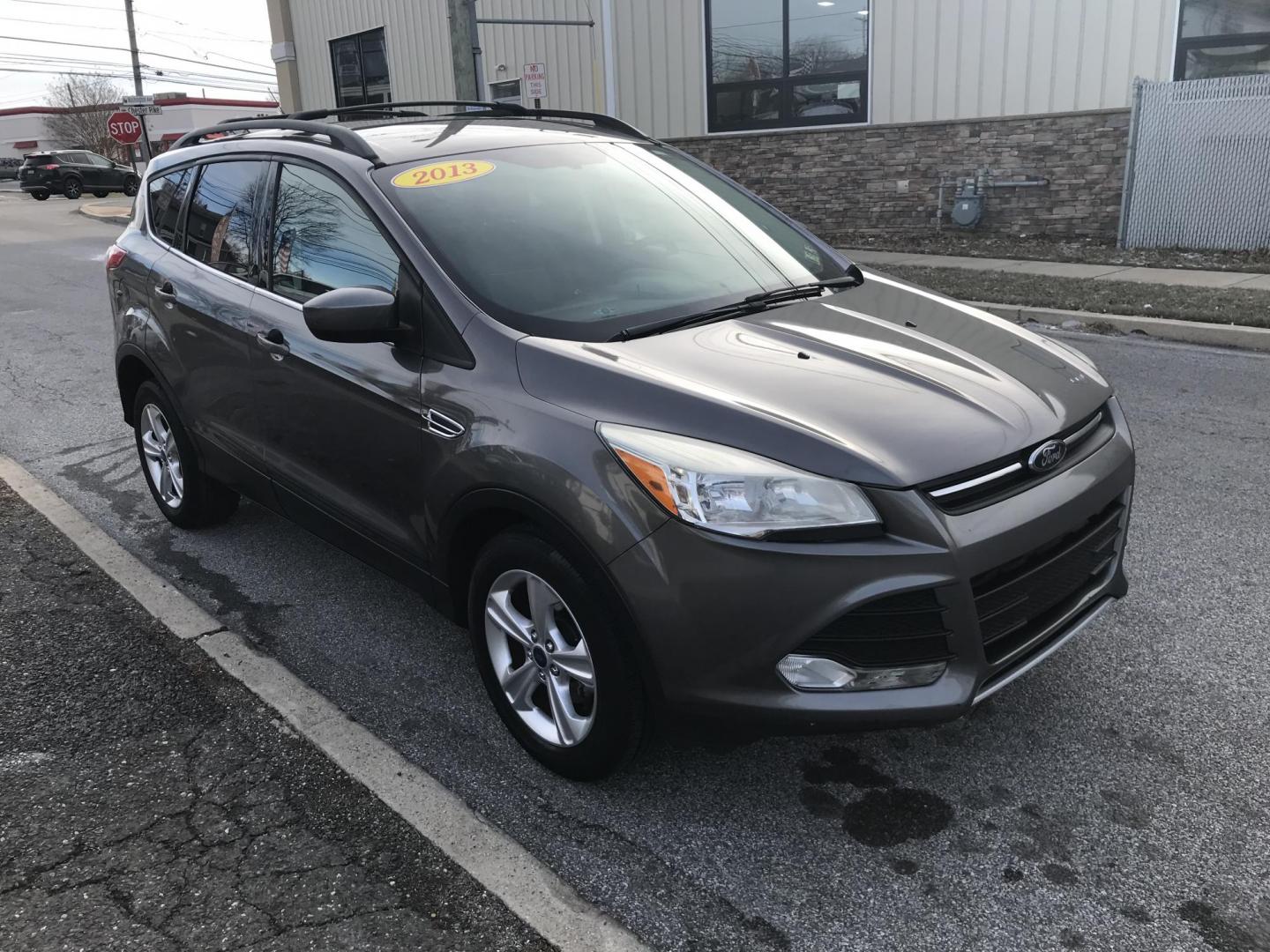 2013 Gray /Gray Ford Escape SE (1FMCU0GX3DU) with an 1.6L L4 DOHC 16V engine, 6-Speed Automatic transmission, located at 577 Chester Pike, Prospect Park, PA, 19076, (610) 237-1015, 39.886154, -75.302338 - 2013 Ford Escape SE: Only 82k miles, new PA inspection, great on gas, SUPER CLEAN! This vehicle comes inspected and has been given a bumper to bumper safety check. It is very clean, reliable, and well maintained. We offer a unique pay plan that is known for being the easiest and fastest financing - Photo#2