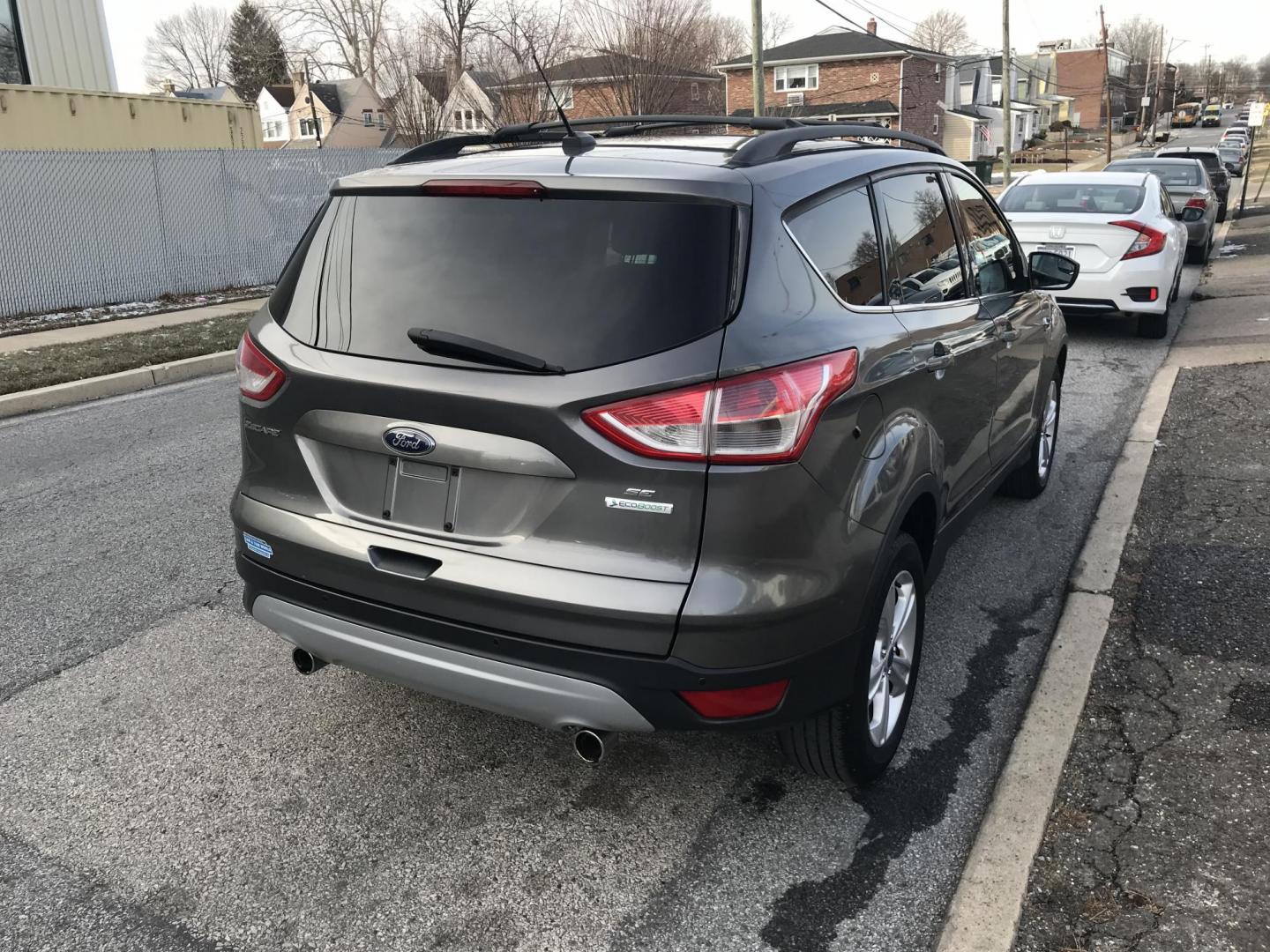 2013 Gray /Gray Ford Escape SE (1FMCU0GX3DU) with an 1.6L L4 DOHC 16V engine, 6-Speed Automatic transmission, located at 577 Chester Pike, Prospect Park, PA, 19076, (610) 237-1015, 39.886154, -75.302338 - 2013 Ford Escape SE: Only 82k miles, new PA inspection, great on gas, SUPER CLEAN! This vehicle comes inspected and has been given a bumper to bumper safety check. It is very clean, reliable, and well maintained. We offer a unique pay plan that is known for being the easiest and fastest financing - Photo#5