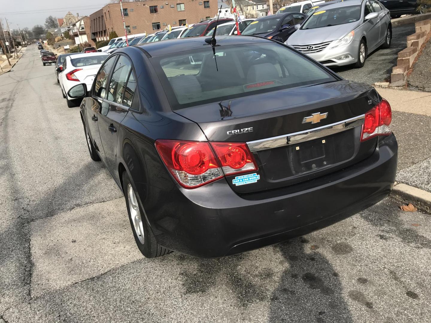 2014 Gray /Black Chevrolet Cruze 1LT Auto (1G1PC5SB7E7) with an 1.4L L4 DOHC 16V TURBO engine, 6-Speed Automatic transmission, located at 577 Chester Pike, Prospect Park, PA, 19076, (610) 237-1015, 39.886154, -75.302338 - Photo#5