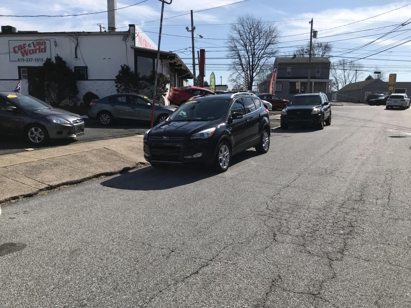 2014 Black /Black Ford Escape Titanium 4WD (1FMCU9J90EU) with an 2.0L L4 DOHC 16V engine, 6-Speed Automatic transmission, located at 577 Chester Pike, Prospect Park, PA, 19076, (610) 237-1015, 39.886154, -75.302338 - 2013 Ford Escape Titanium: Navigation system, backup camera, 4x4, new PA inspection, runs LIKE NEW! This vehicle comes inspected and has been given a bumper to bumper safety check. It is very clean, reliable, and well maintained. We offer a unique pay plan that is known for being the easiest and - Photo#1