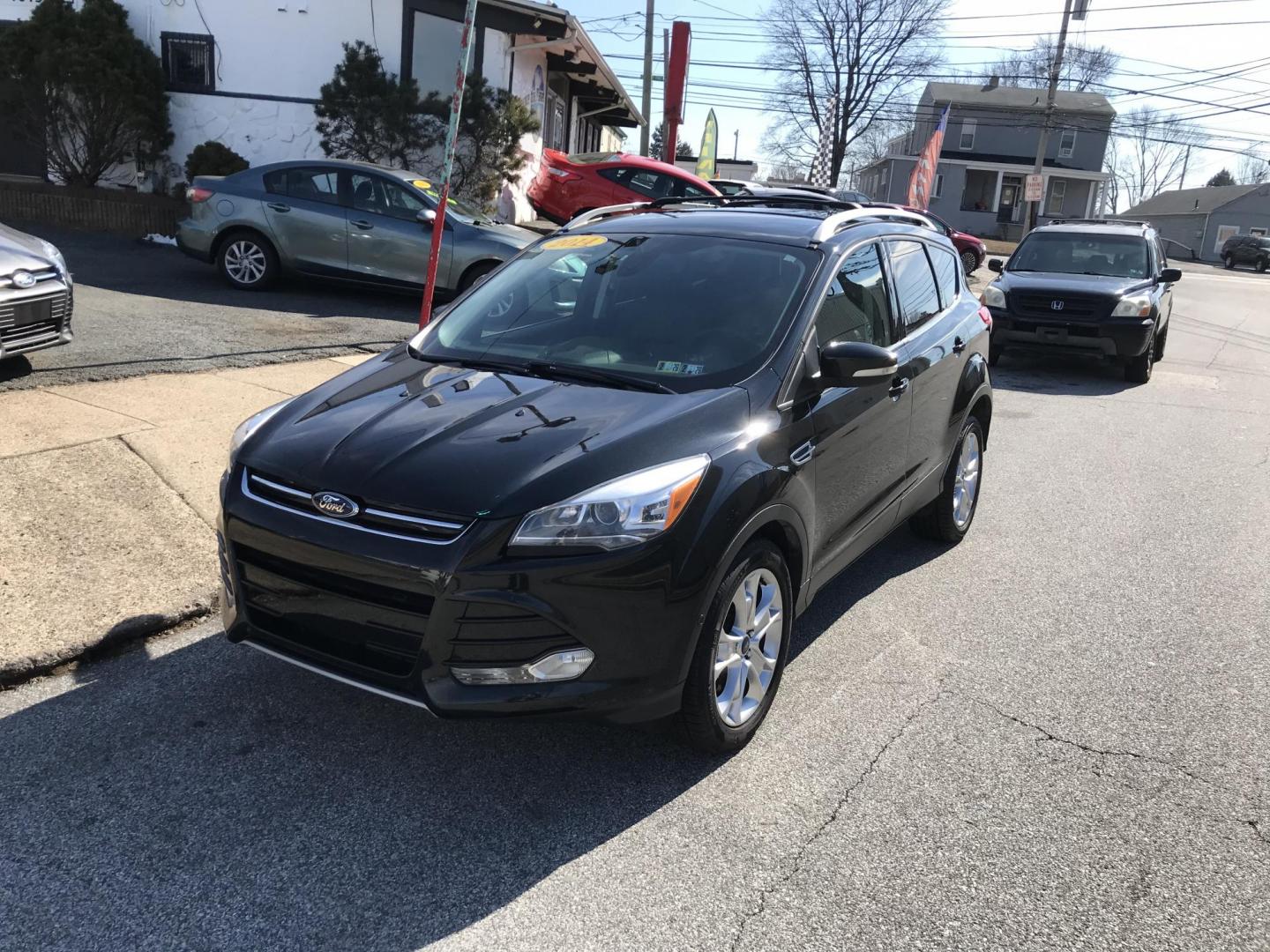 2014 Black /Black Ford Escape Titanium 4WD (1FMCU9J90EU) with an 2.0L L4 DOHC 16V engine, 6-Speed Automatic transmission, located at 577 Chester Pike, Prospect Park, PA, 19076, (610) 237-1015, 39.886154, -75.302338 - 2013 Ford Escape Titanium: Navigation system, backup camera, 4x4, new PA inspection, runs LIKE NEW! This vehicle comes inspected and has been given a bumper to bumper safety check. It is very clean, reliable, and well maintained. We offer a unique pay plan that is known for being the easiest and - Photo#2