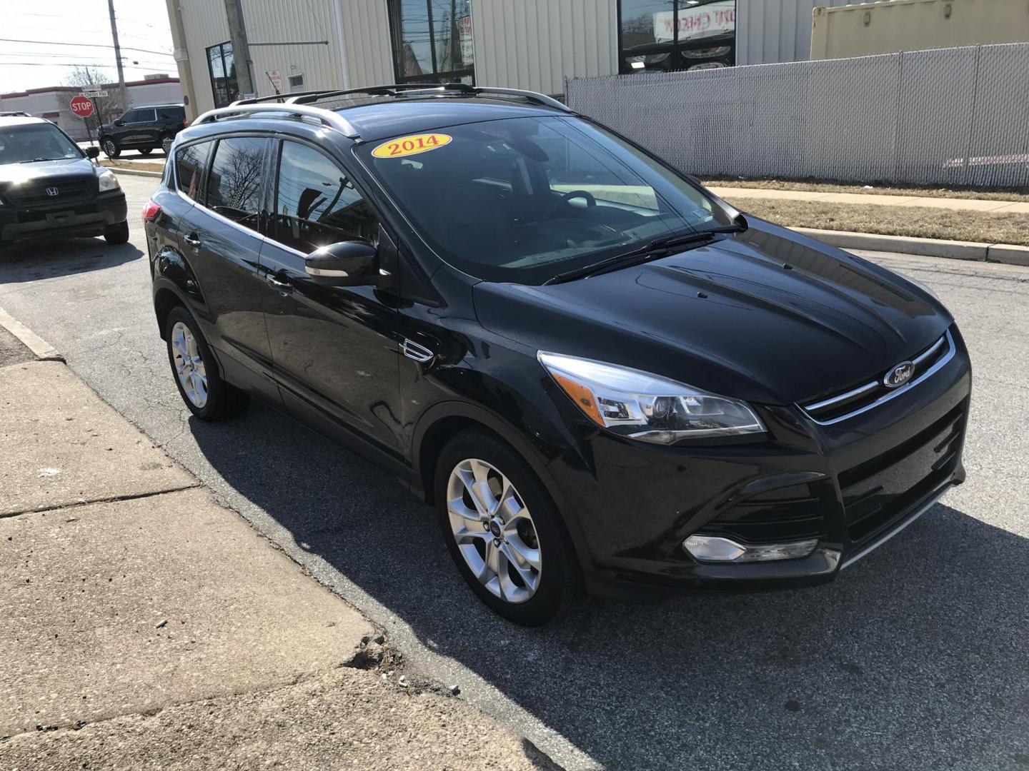2014 Black /Black Ford Escape Titanium 4WD (1FMCU9J90EU) with an 2.0L L4 DOHC 16V engine, 6-Speed Automatic transmission, located at 577 Chester Pike, Prospect Park, PA, 19076, (610) 237-1015, 39.886154, -75.302338 - 2013 Ford Escape Titanium: Navigation system, backup camera, 4x4, new PA inspection, runs LIKE NEW! This vehicle comes inspected and has been given a bumper to bumper safety check. It is very clean, reliable, and well maintained. We offer a unique pay plan that is known for being the easiest and - Photo#3