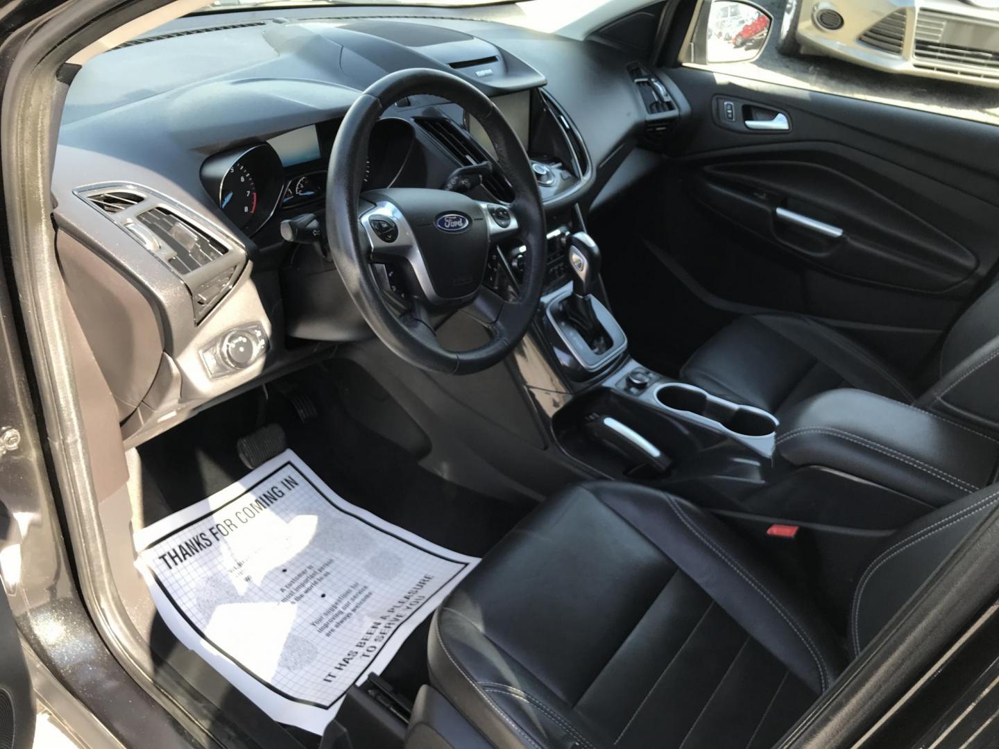 2014 Black /Black Ford Escape Titanium 4WD (1FMCU9J90EU) with an 2.0L L4 DOHC 16V engine, 6-Speed Automatic transmission, located at 577 Chester Pike, Prospect Park, PA, 19076, (610) 237-1015, 39.886154, -75.302338 - 2013 Ford Escape Titanium: Navigation system, backup camera, 4x4, new PA inspection, runs LIKE NEW! This vehicle comes inspected and has been given a bumper to bumper safety check. It is very clean, reliable, and well maintained. We offer a unique pay plan that is known for being the easiest and - Photo#6