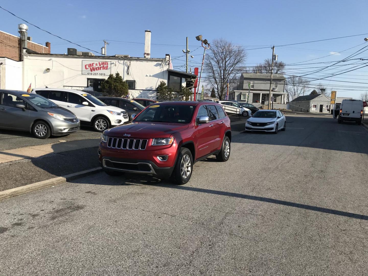2015 Red /Black Jeep Grand Cherokee Limited 4WD (1C4RJFBGXFC) with an 3.6L V6 DOHC 24V engine, 8-Speed Automatic transmission, located at 577 Chester Pike, Prospect Park, PA, 19076, (610) 237-1015, 39.886154, -75.302338 - Photo#1
