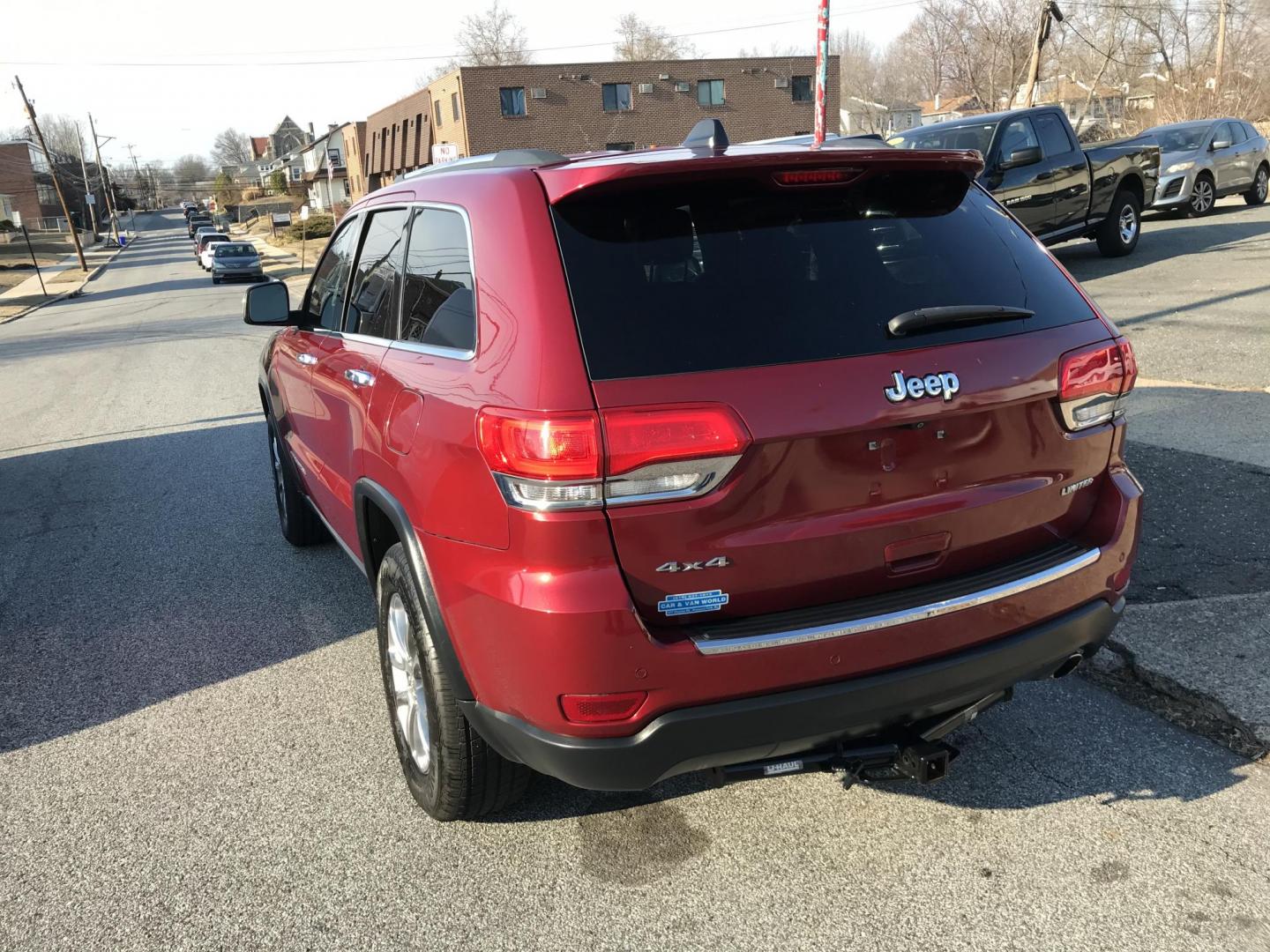 2015 Red /Black Jeep Grand Cherokee Limited 4WD (1C4RJFBGXFC) with an 3.6L V6 DOHC 24V engine, 8-Speed Automatic transmission, located at 577 Chester Pike, Prospect Park, PA, 19076, (610) 237-1015, 39.886154, -75.302338 - Photo#4