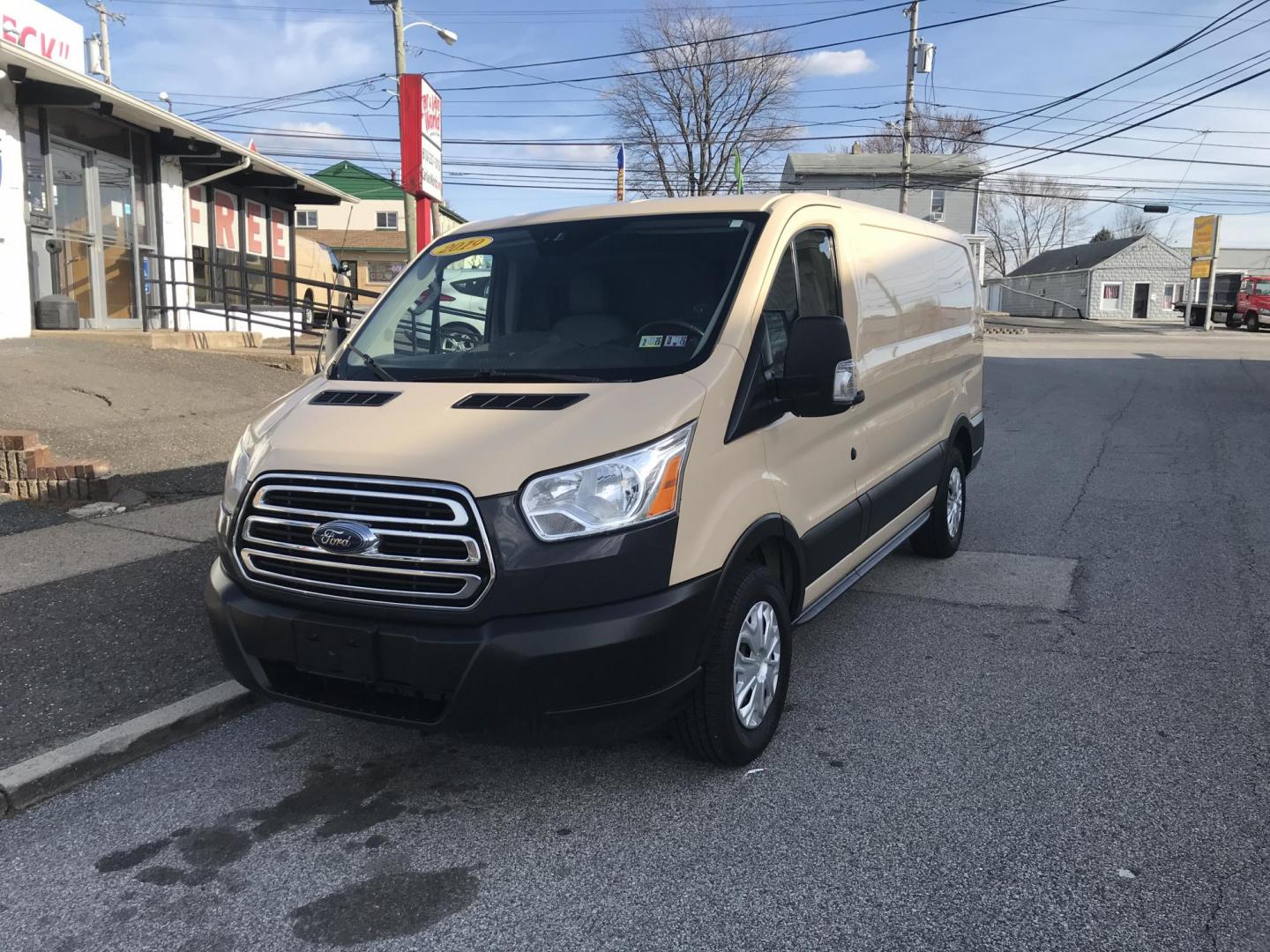 2019 Tan /Gray Ford Transit 150 Van Low Roof w/Sliding Pass. 130-in. WB (1FTYE1YM1KK) with an 3.7L V6 DOHC 24V engine, 6A transmission, located at 577 Chester Pike, Prospect Park, PA, 19076, (610) 237-1015, 39.886154, -75.302338 - 2019 Ford Transit 150 Low Roof: Multiple pieces of shelving, backup camera, fully metal body, partition, FLEET MAINTAINED, looks and runs LIKE NEW! This vehicle comes inspected and has been given a bumper to bumper safety check. It is very clean, reliable, and well maintained. We offer a unique p - Photo#2