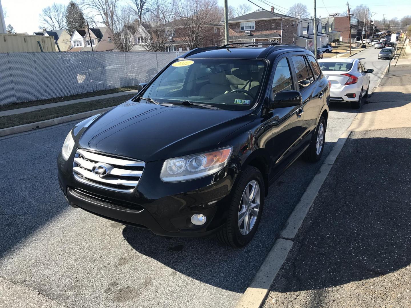 2012 Black /Tan Hyundai Santa Fe Limited 3.5 4WD (5XYZKDAG1CG) with an 3.5L V6 DOHC 24V engine, 6-Speed Automatic transmission, located at 577 Chester Pike, Prospect Park, PA, 19076, (610) 237-1015, 39.886154, -75.302338 - Photo#3