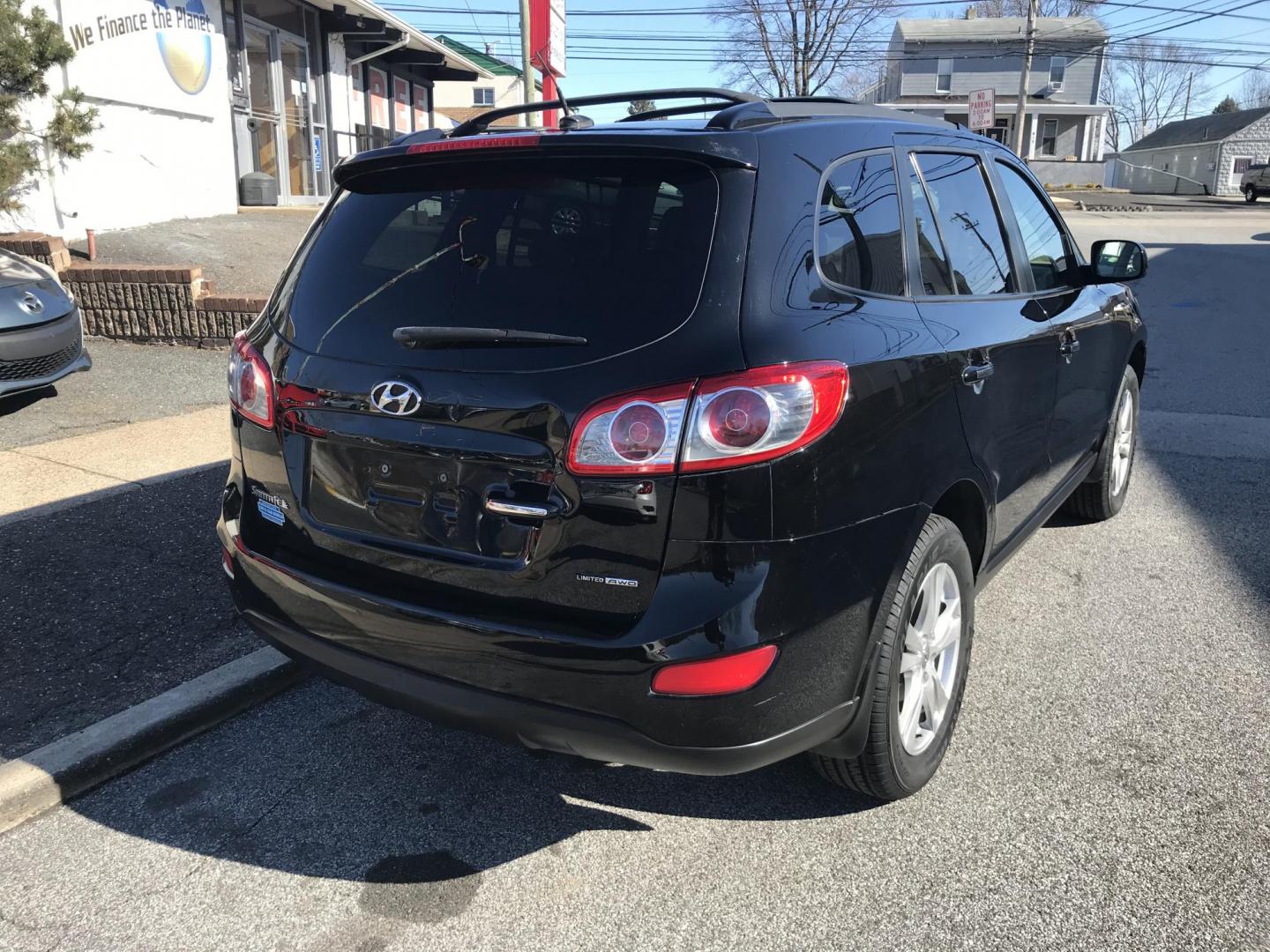 2012 Black /Tan Hyundai Santa Fe Limited 3.5 4WD (5XYZKDAG1CG) with an 3.5L V6 DOHC 24V engine, 6-Speed Automatic transmission, located at 577 Chester Pike, Prospect Park, PA, 19076, (610) 237-1015, 39.886154, -75.302338 - Photo#8