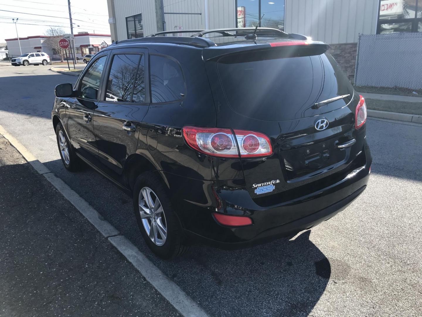 2012 Black /Tan Hyundai Santa Fe Limited 3.5 4WD (5XYZKDAG1CG) with an 3.5L V6 DOHC 24V engine, 6-Speed Automatic transmission, located at 577 Chester Pike, Prospect Park, PA, 19076, (610) 237-1015, 39.886154, -75.302338 - Photo#9