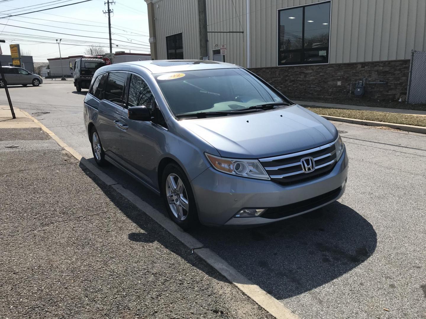 2012 Blue /Gray Honda Odyssey Touring (5FNRL5H9XCB) with an 3.5L V6 SOHC 24V engine, 5-Speed Automatic transmission, located at 577 Chester Pike, Prospect Park, PA, 19076, (610) 237-1015, 39.886154, -75.302338 - Photo#3
