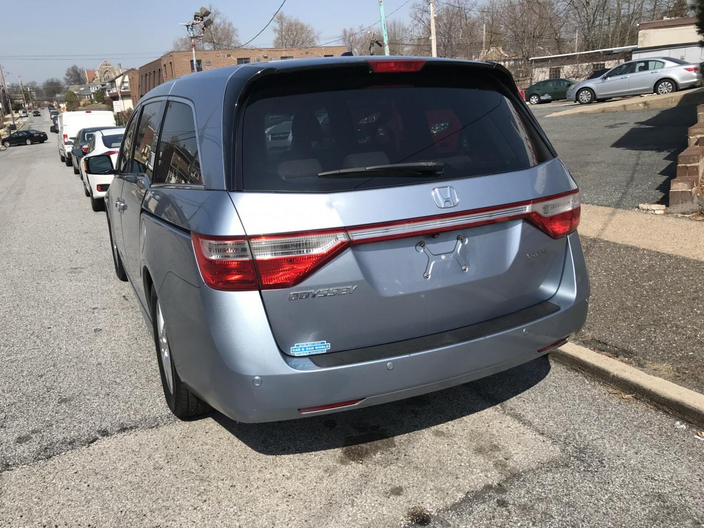 2012 Blue /Gray Honda Odyssey Touring (5FNRL5H9XCB) with an 3.5L V6 SOHC 24V engine, 5-Speed Automatic transmission, located at 577 Chester Pike, Prospect Park, PA, 19076, (610) 237-1015, 39.886154, -75.302338 - Photo#5