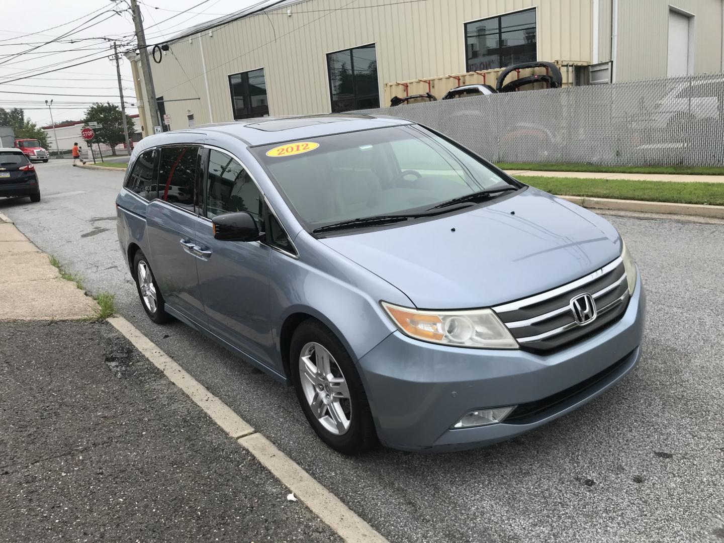 2012 Blue /Gray Honda Odyssey Touring (5FNRL5H9XCB) with an 3.5L V6 SOHC 24V engine, 5-Speed Automatic transmission, located at 577 Chester Pike, Prospect Park, PA, 19076, (610) 237-1015, 39.886154, -75.302338 - 2012 Honda Odyssey Touring 155k miles • DVD Player. Navigation System. Example Financing: • $3,000 Down • $100 Weekly • $200 Bi-Weekly We finance our own vehicles. We do not obtain or review traditional consumer credit reports. Financing decisions are based on verified income, ability- Photo#3