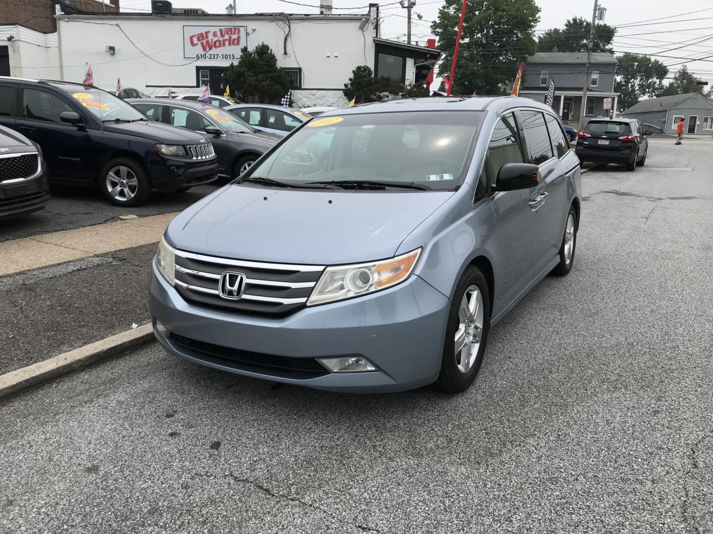 2012 Blue /Gray Honda Odyssey Touring (5FNRL5H9XCB) with an 3.5L V6 SOHC 24V engine, 5-Speed Automatic transmission, located at 577 Chester Pike, Prospect Park, PA, 19076, (610) 237-1015, 39.886154, -75.302338 - 2012 Honda Odyssey Touring 155k miles • DVD Player. Navigation System. Example Financing: • $3,000 Down • $100 Weekly • $200 Bi-Weekly We finance our own vehicles. We do not obtain or review traditional consumer credit reports. Financing decisions are based on verified income, ability- Photo#2