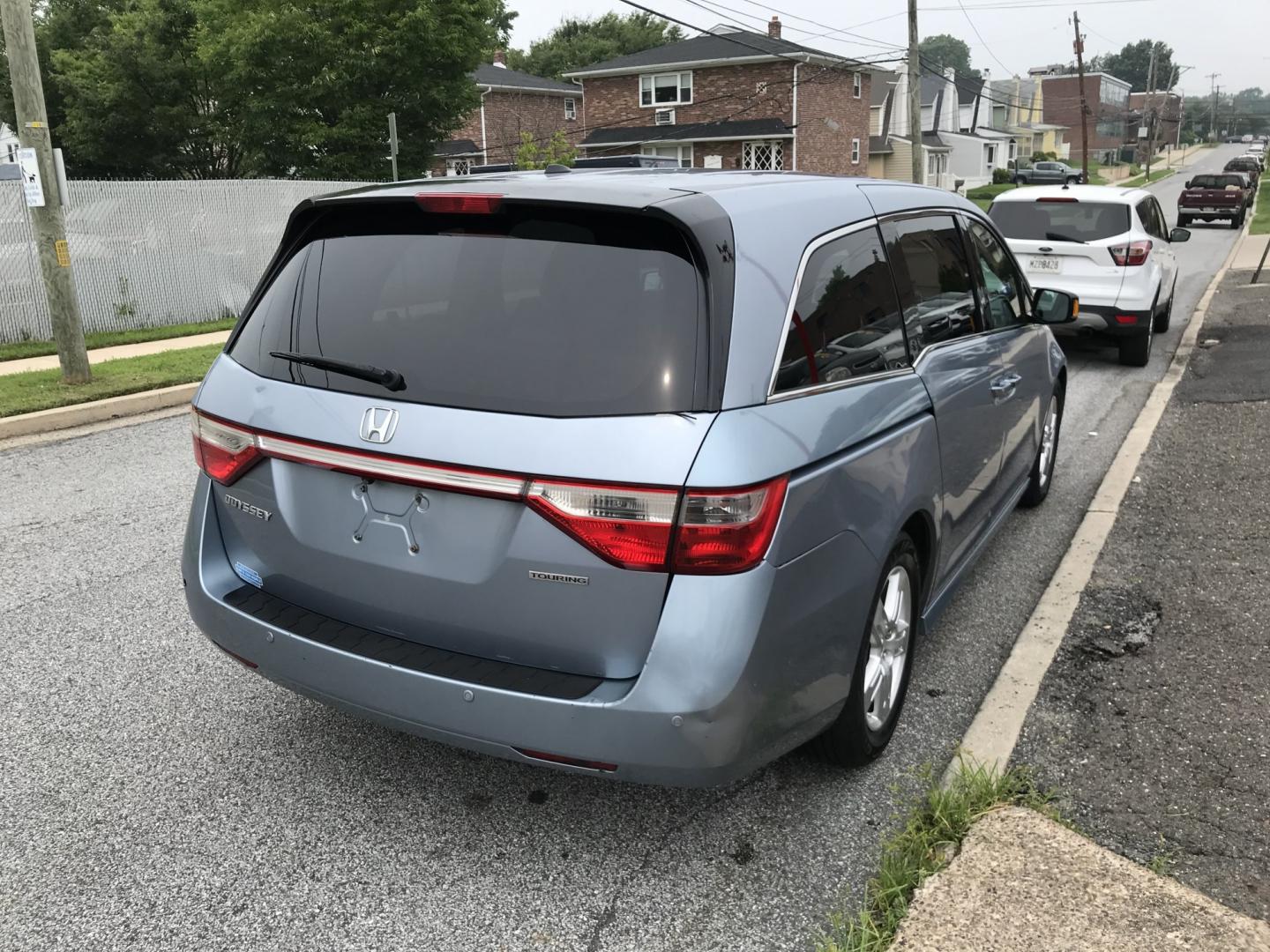 2012 Blue /Gray Honda Odyssey Touring (5FNRL5H9XCB) with an 3.5L V6 SOHC 24V engine, 5-Speed Automatic transmission, located at 577 Chester Pike, Prospect Park, PA, 19076, (610) 237-1015, 39.886154, -75.302338 - 2012 Honda Odyssey Touring 155k miles • DVD Player. Navigation System. Example Financing: • $3,000 Down • $100 Weekly • $200 Bi-Weekly We finance our own vehicles. We do not obtain or review traditional consumer credit reports. Financing decisions are based on verified income, ability- Photo#4