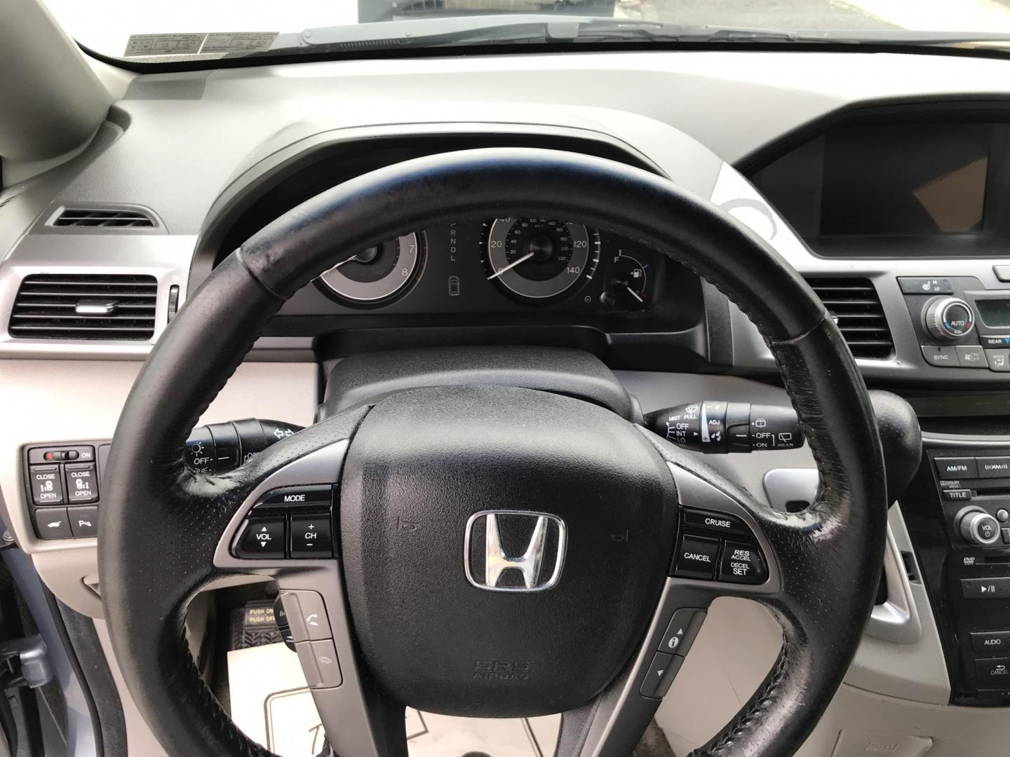 2012 Blue /Gray Honda Odyssey Touring (5FNRL5H9XCB) with an 3.5L V6 SOHC 24V engine, 5-Speed Automatic transmission, located at 577 Chester Pike, Prospect Park, PA, 19076, (610) 237-1015, 39.886154, -75.302338 - 2012 Honda Odyssey Touring 155k miles • DVD Player. Navigation System. Example Financing: • $3,000 Down • $100 Weekly • $200 Bi-Weekly We finance our own vehicles. We do not obtain or review traditional consumer credit reports. Financing decisions are based on verified income, ability- Photo#13