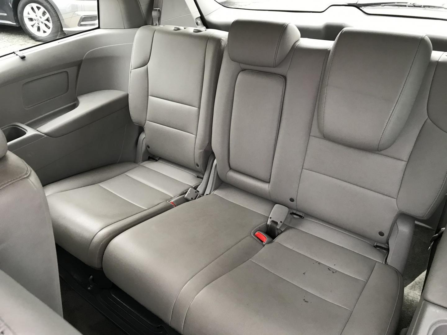 2012 Blue /Gray Honda Odyssey Touring (5FNRL5H9XCB) with an 3.5L V6 SOHC 24V engine, 5-Speed Automatic transmission, located at 577 Chester Pike, Prospect Park, PA, 19076, (610) 237-1015, 39.886154, -75.302338 - 2012 Honda Odyssey Touring 155k miles • DVD Player. Navigation System. Example Financing: • $3,000 Down • $100 Weekly • $200 Bi-Weekly We finance our own vehicles. We do not obtain or review traditional consumer credit reports. Financing decisions are based on verified income, ability- Photo#20