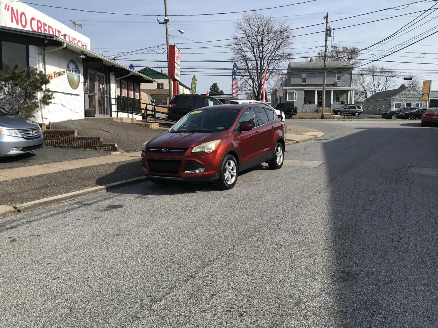 2015 Red /Gray Ford Escape SE 4WD (1FMCU9GX1FU) with an 1.6L L4 DOHC 16V engine, 6-Speed Automatic transmission, located at 577 Chester Pike, Prospect Park, PA, 19076, (610) 237-1015, 39.886154, -75.302338 - 2015 Ford Escape SE: Only 115k miles, 4x4, new PA inspection, great on gas, SUPER CLEAN, runs LIKE NEW! This vehicle comes inspected and has been given a bumper to bumper safety check. It is very clean, reliable, and well maintained. We offer a unique pay plan that is known for being the easiest - Photo#2
