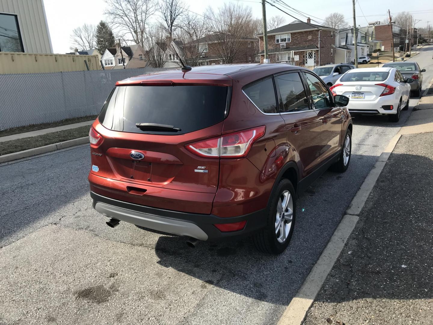 2015 Red /Gray Ford Escape SE 4WD (1FMCU9GX1FU) with an 1.6L L4 DOHC 16V engine, 6-Speed Automatic transmission, located at 577 Chester Pike, Prospect Park, PA, 19076, (610) 237-1015, 39.886154, -75.302338 - 2015 Ford Escape SE: Only 115k miles, 4x4, new PA inspection, great on gas, SUPER CLEAN, runs LIKE NEW! This vehicle comes inspected and has been given a bumper to bumper safety check. It is very clean, reliable, and well maintained. We offer a unique pay plan that is known for being the easiest - Photo#4