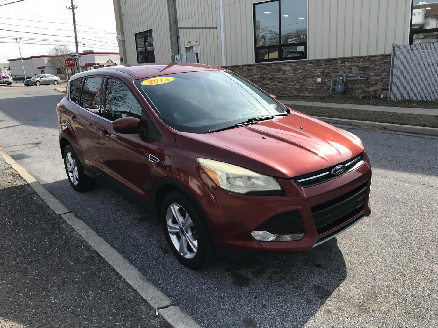2015 Red /Gray Ford Escape SE 4WD (1FMCU9GX1FU) with an 1.6L L4 DOHC 16V engine, 6-Speed Automatic transmission, located at 577 Chester Pike, Prospect Park, PA, 19076, (610) 237-1015, 39.886154, -75.302338 - 2015 Ford Escape SE: Only 115k miles, 4x4, new PA inspection, great on gas, SUPER CLEAN, runs LIKE NEW! This vehicle comes inspected and has been given a bumper to bumper safety check. It is very clean, reliable, and well maintained. We offer a unique pay plan that is known for being the easiest - Photo#5