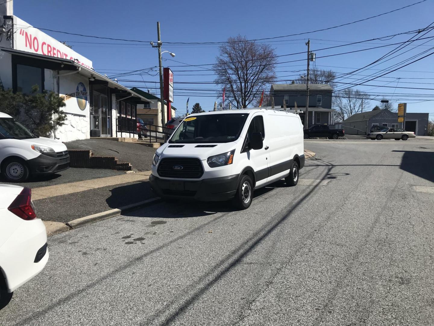 2017 White /Gray Ford Transit 150 Van Low Roof 60/40 Pass. 130-in. WB (1FTYE1ZMXHK) with an 3.7L V6 DOHC 24V engine, 6A transmission, located at 577 Chester Pike, Prospect Park, PA, 19076, (610) 237-1015, 39.886154, -75.302338 - 2017 Ford Transit 150: Ladder racks, multiple pieces of shelving, no side or rear windows, backup camera, FLEET MAINTAINED, runs LIKE NEW! This vehicle comes inspected and has been given a bumper to bumper safety check. It is very clean, reliable, and well maintained. We offer a unique pay plan t - Photo#2