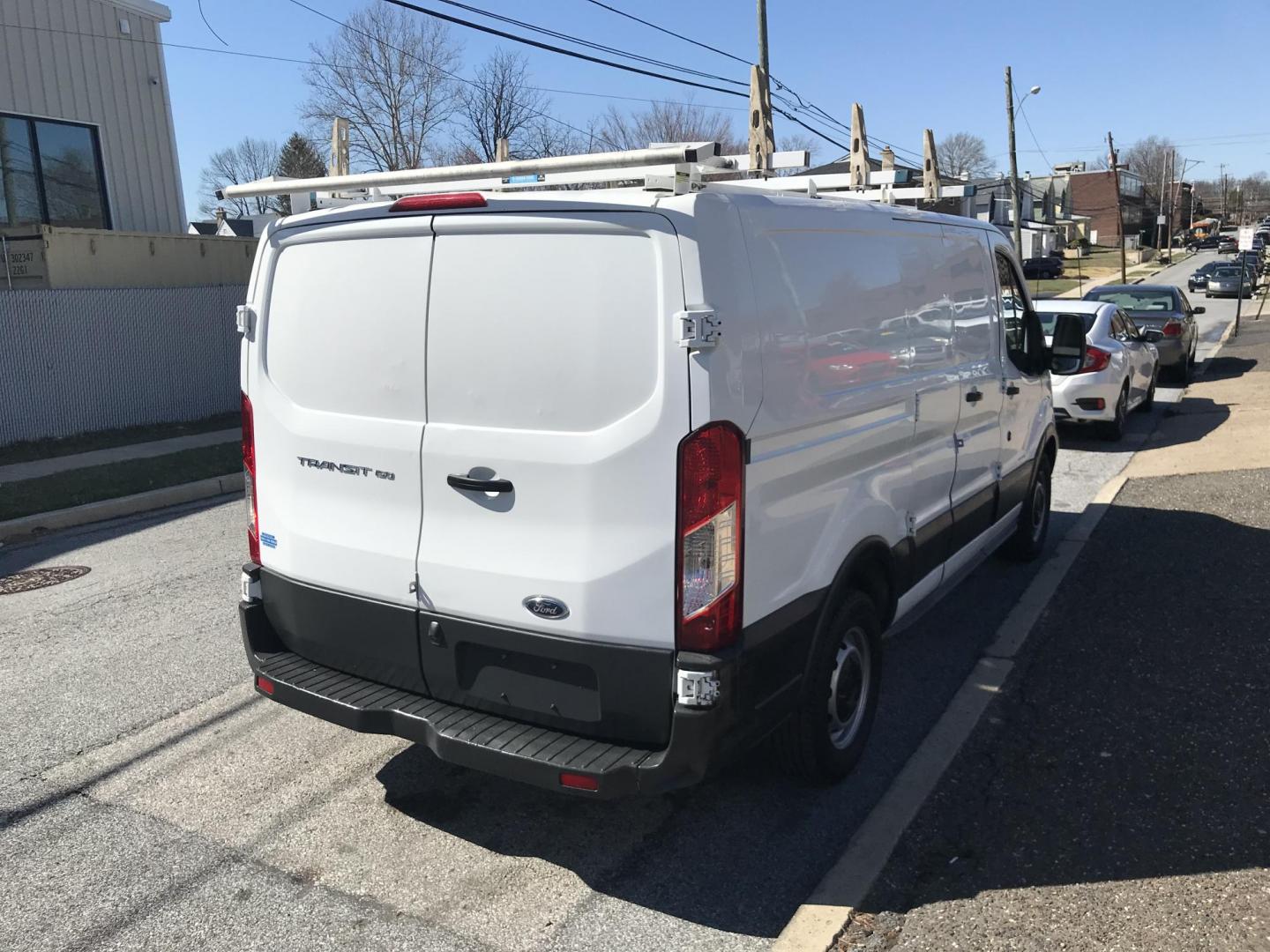 2017 White /Gray Ford Transit 150 Van Low Roof 60/40 Pass. 130-in. WB (1FTYE1ZMXHK) with an 3.7L V6 DOHC 24V engine, 6A transmission, located at 577 Chester Pike, Prospect Park, PA, 19076, (610) 237-1015, 39.886154, -75.302338 - 2017 Ford Transit 150: Ladder racks, multiple pieces of shelving, no side or rear windows, backup camera, FLEET MAINTAINED, runs LIKE NEW! This vehicle comes inspected and has been given a bumper to bumper safety check. It is very clean, reliable, and well maintained. We offer a unique pay plan t - Photo#5